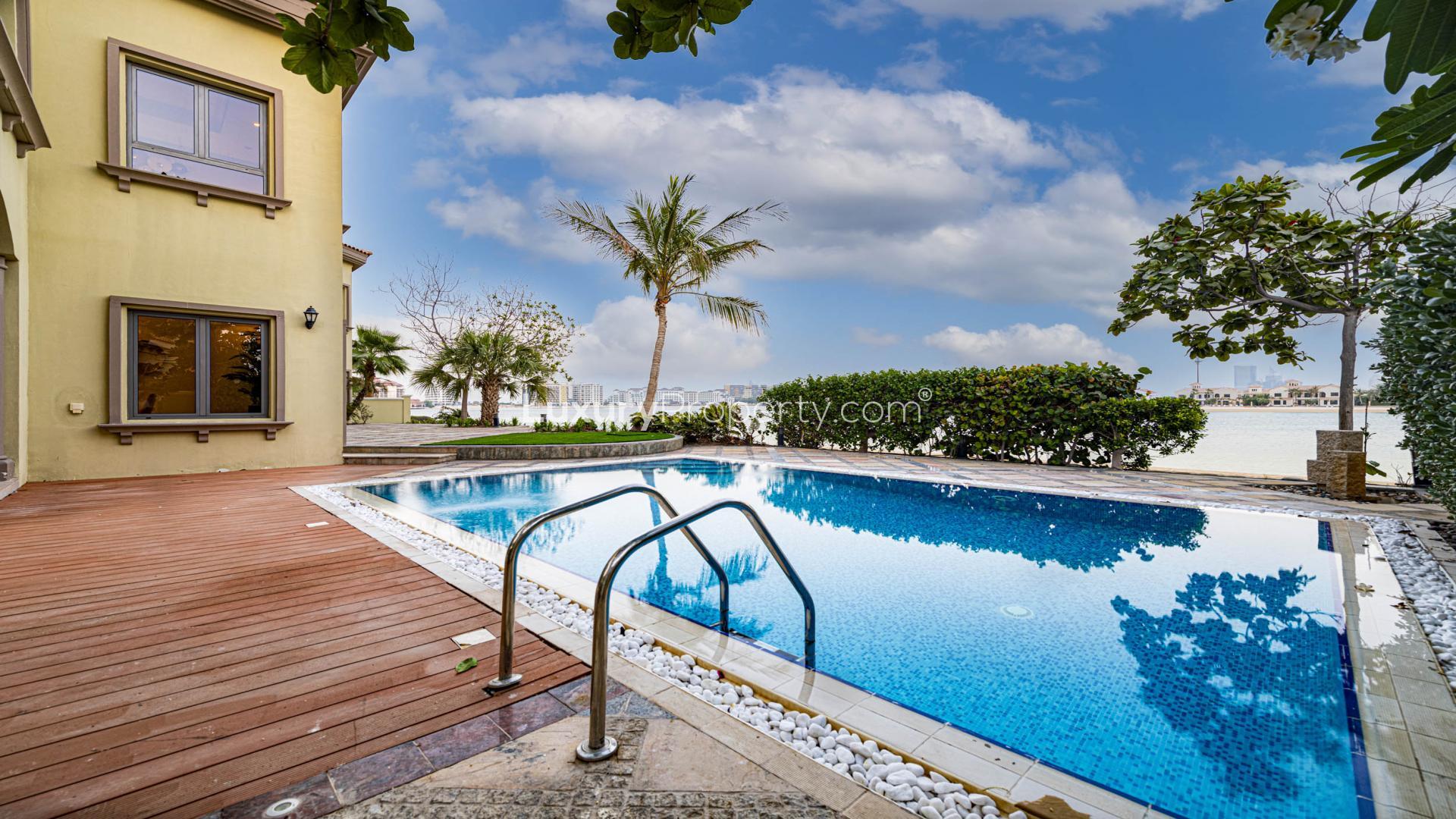 Luxurious living room in Palm Jumeirah villa with elegant decor and sea view