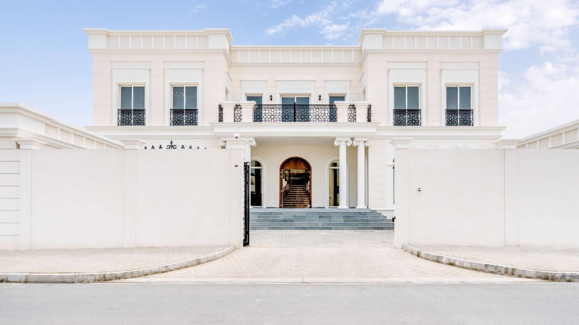 Luxurious 8-bedroom villa exterior, Pearl Jumeirah, showcasing grand entrance and elegant design