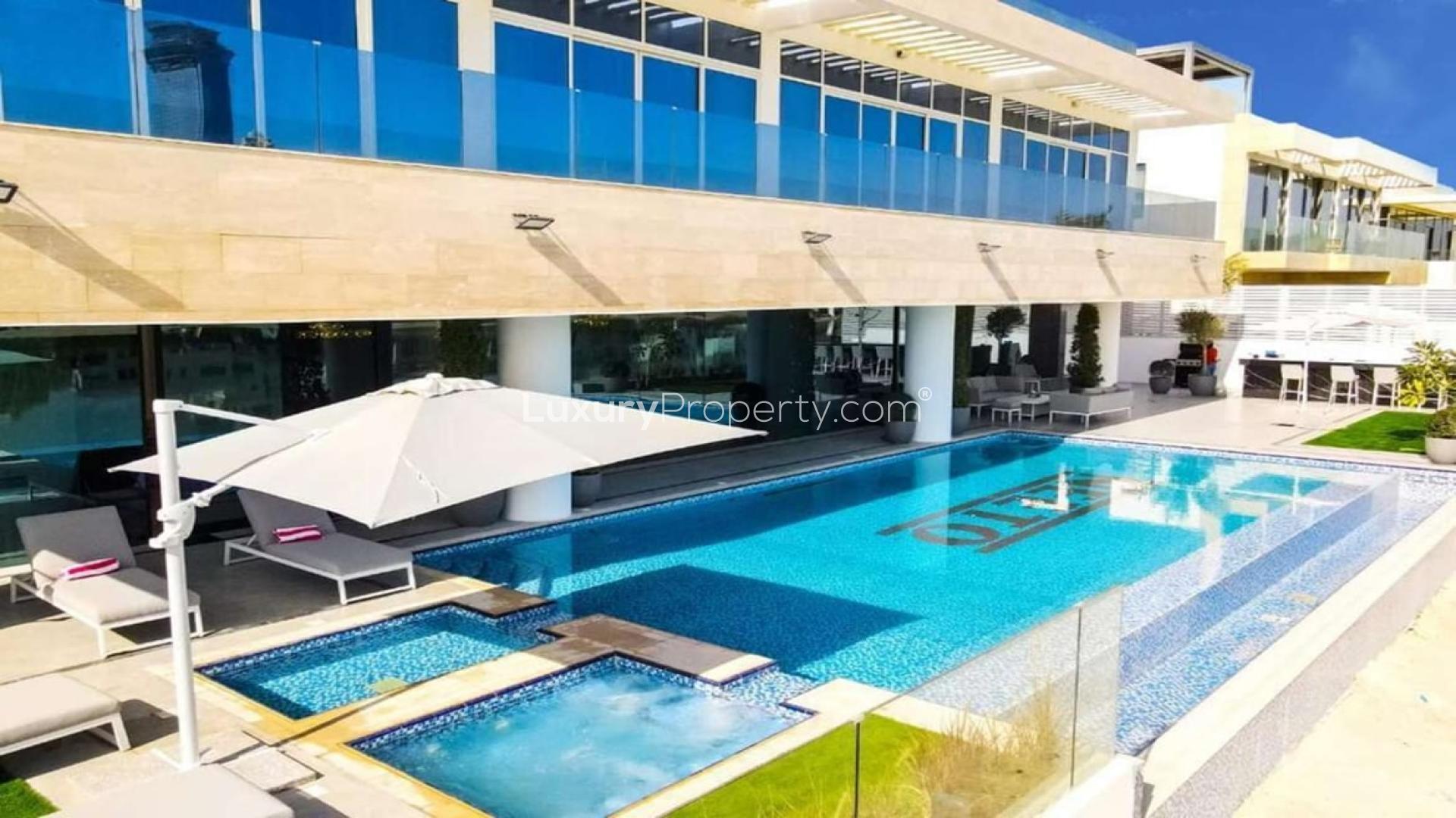 Luxury villa poolside view with loungers on Palm Jumeirah, Dubai, Signature Villas community