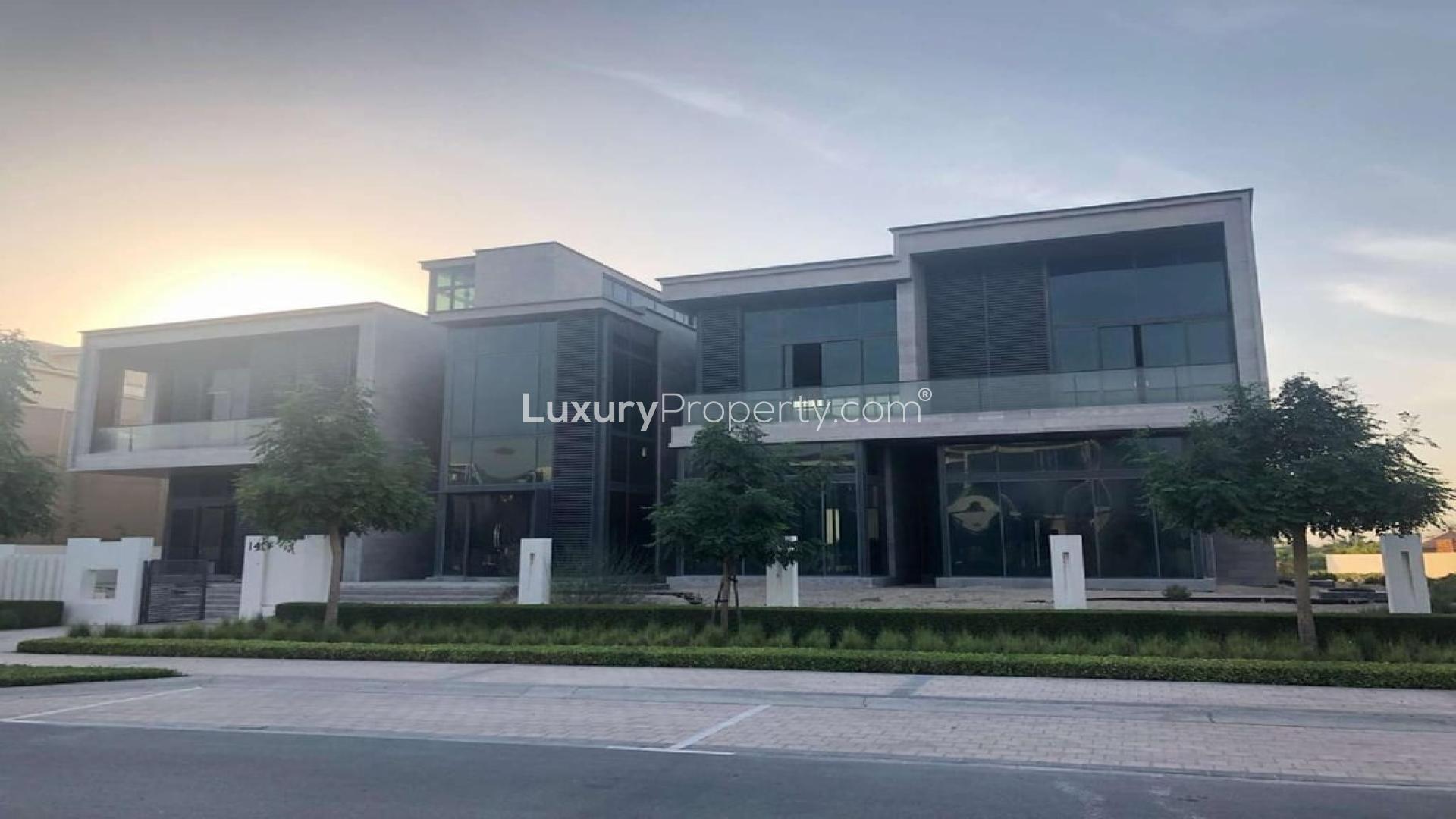 Modern 8-bedroom villa exterior in Dubai Hills Grove, showcasing contemporary architecture and lush surroundings