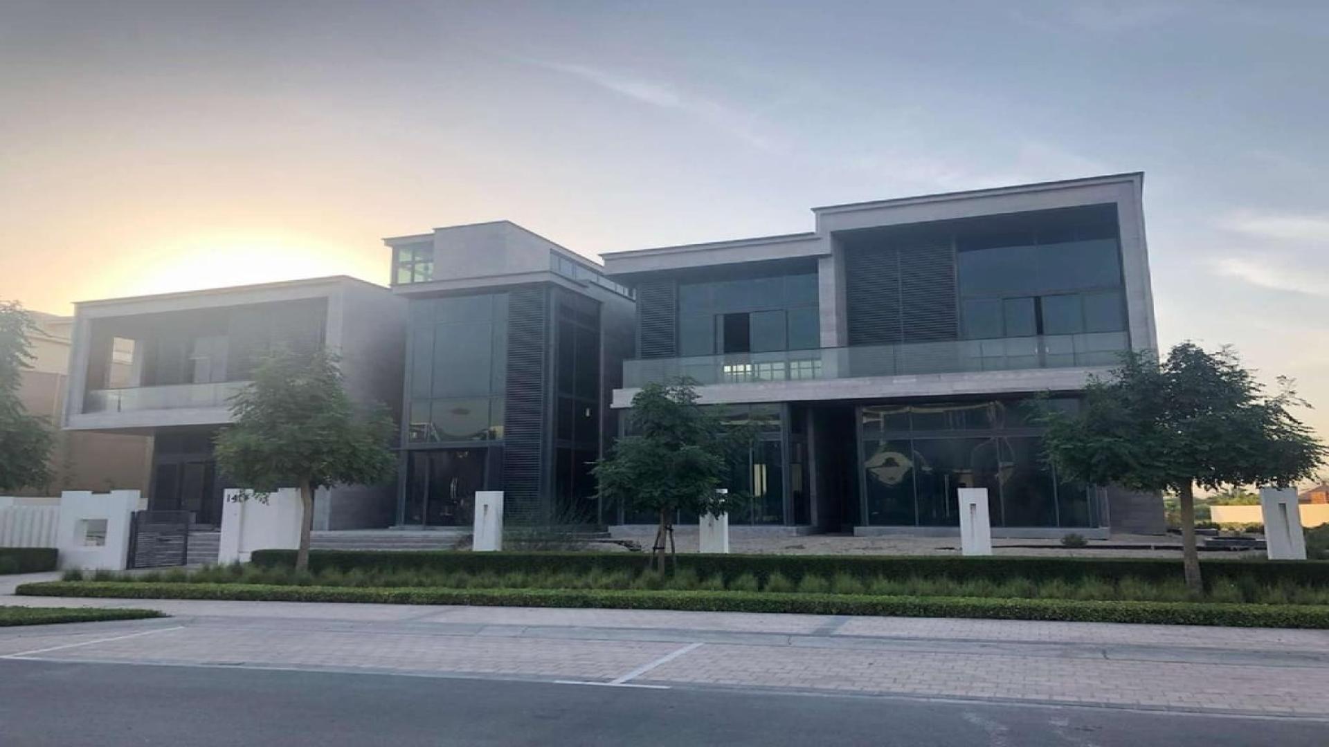 Modern 8-bedroom villa exterior in Dubai Hills Grove, showcasing contemporary architecture and lush surroundings