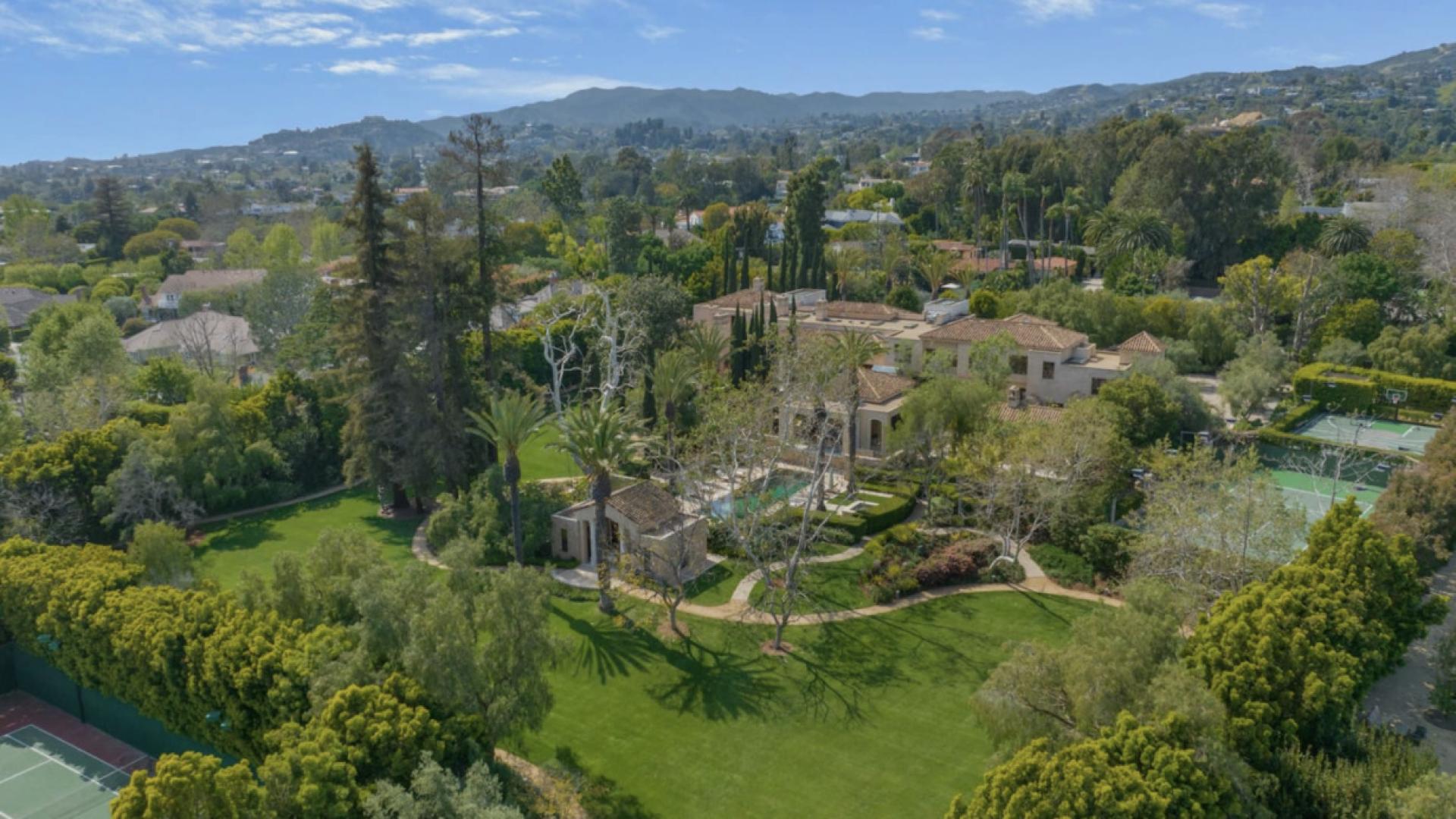 Luxurious Brentwood living room with fireplace in 8-bedroom estate for sale on Crescenda St