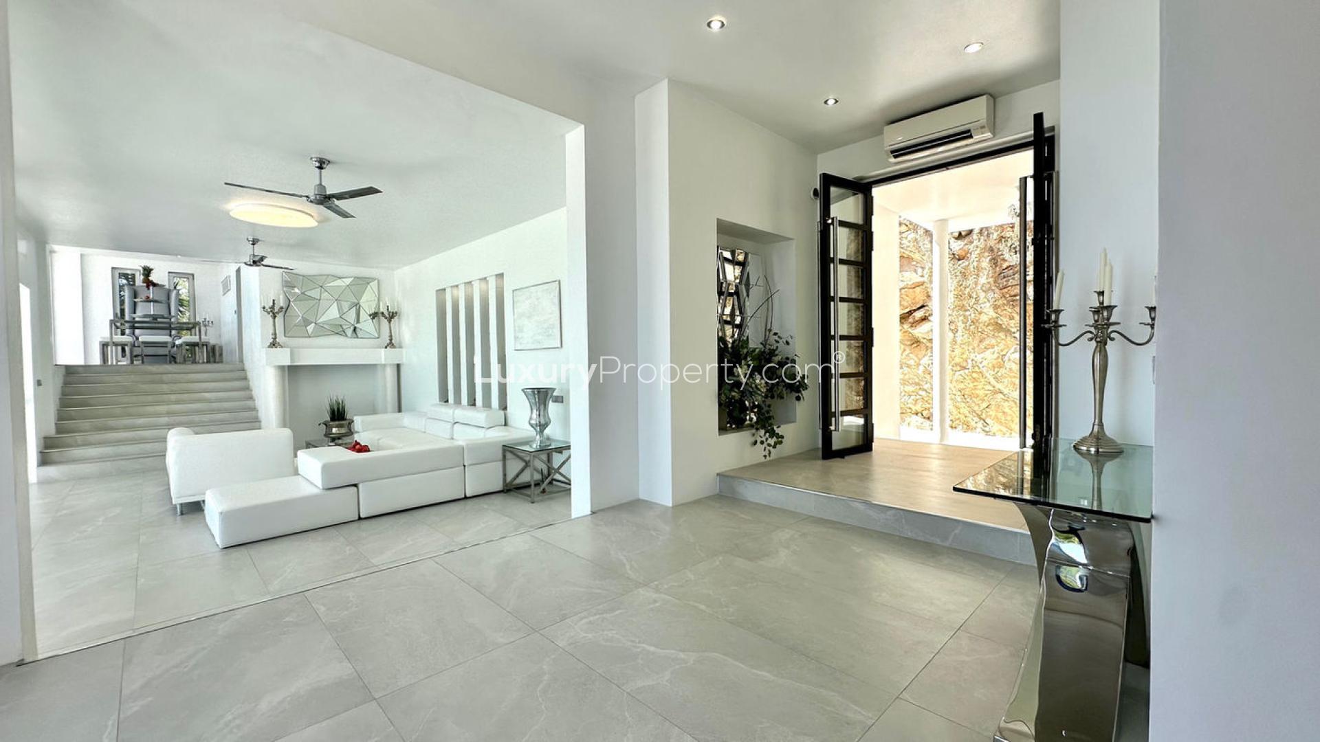 Villa Roca in Ibiza with pool, surrounded by lush greenery, for sale