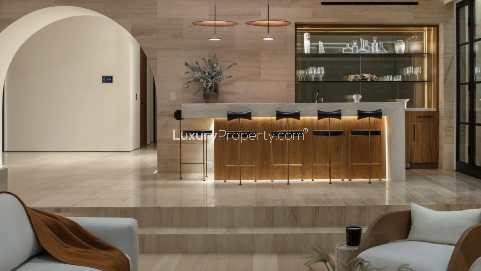 Modern Bel Air villa exterior at sunset, featuring sleek design and lush landscaping