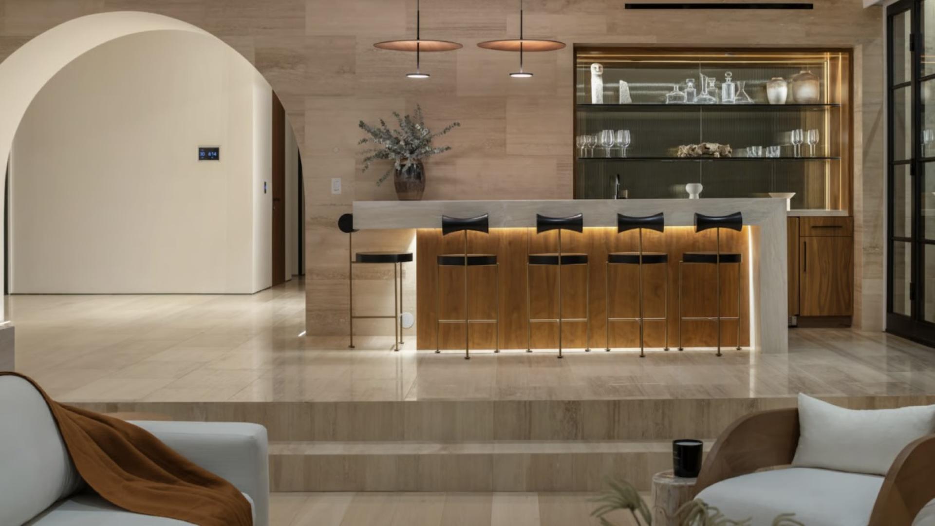 Modern Bel Air villa exterior at sunset, featuring sleek design and lush landscaping