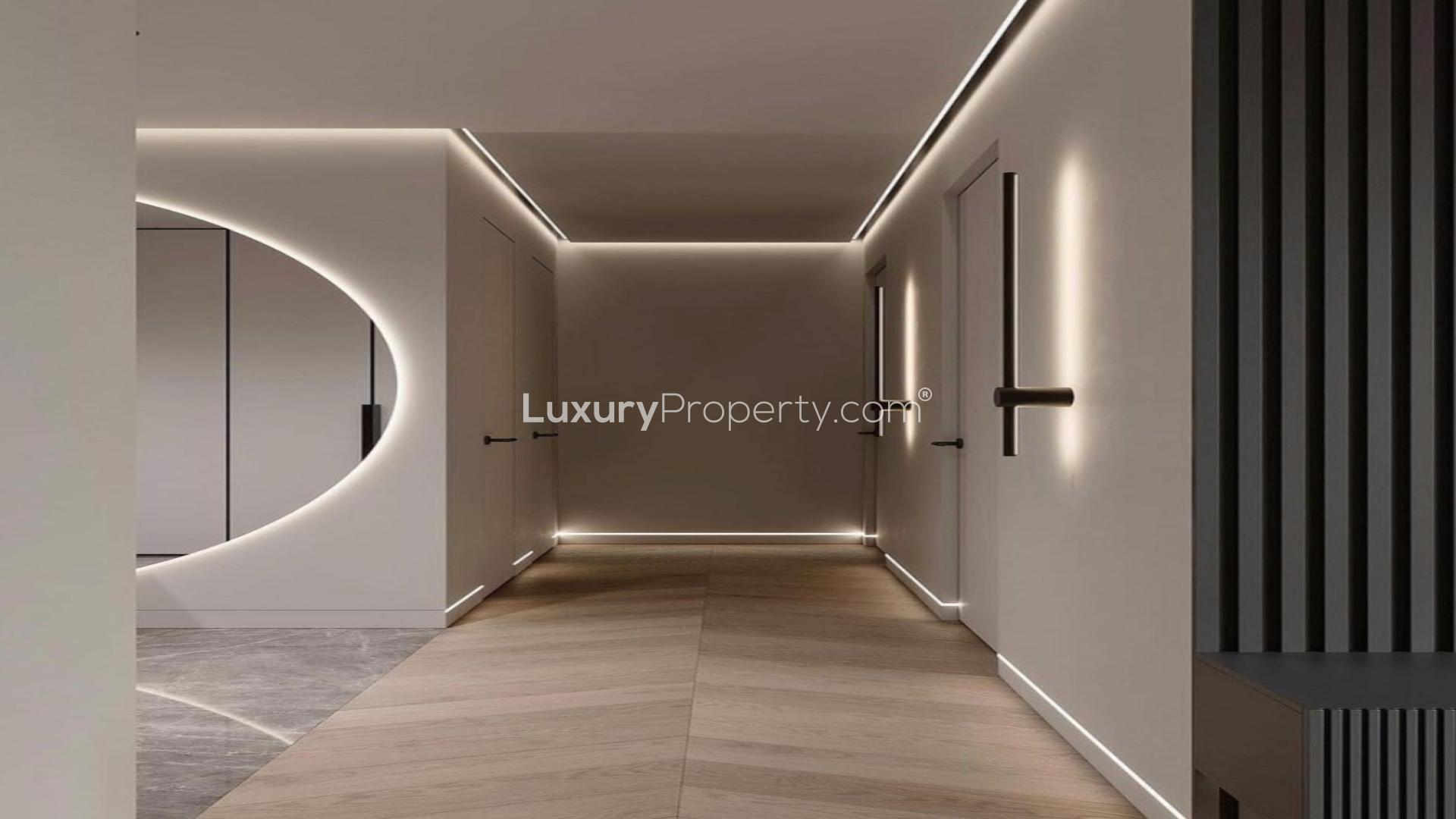 Luxurious living room in Jumeirah Islands villa with modern decor and elegant chandelier