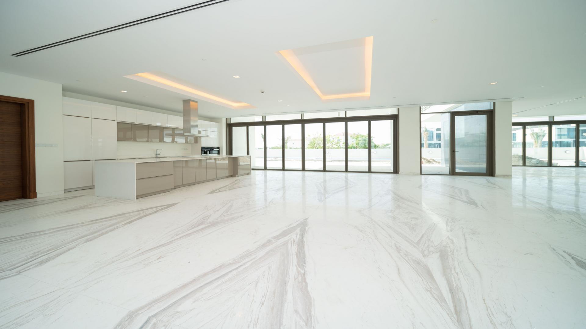 Contemporary villa interior with marble floors and glass railings in District One, Dubai