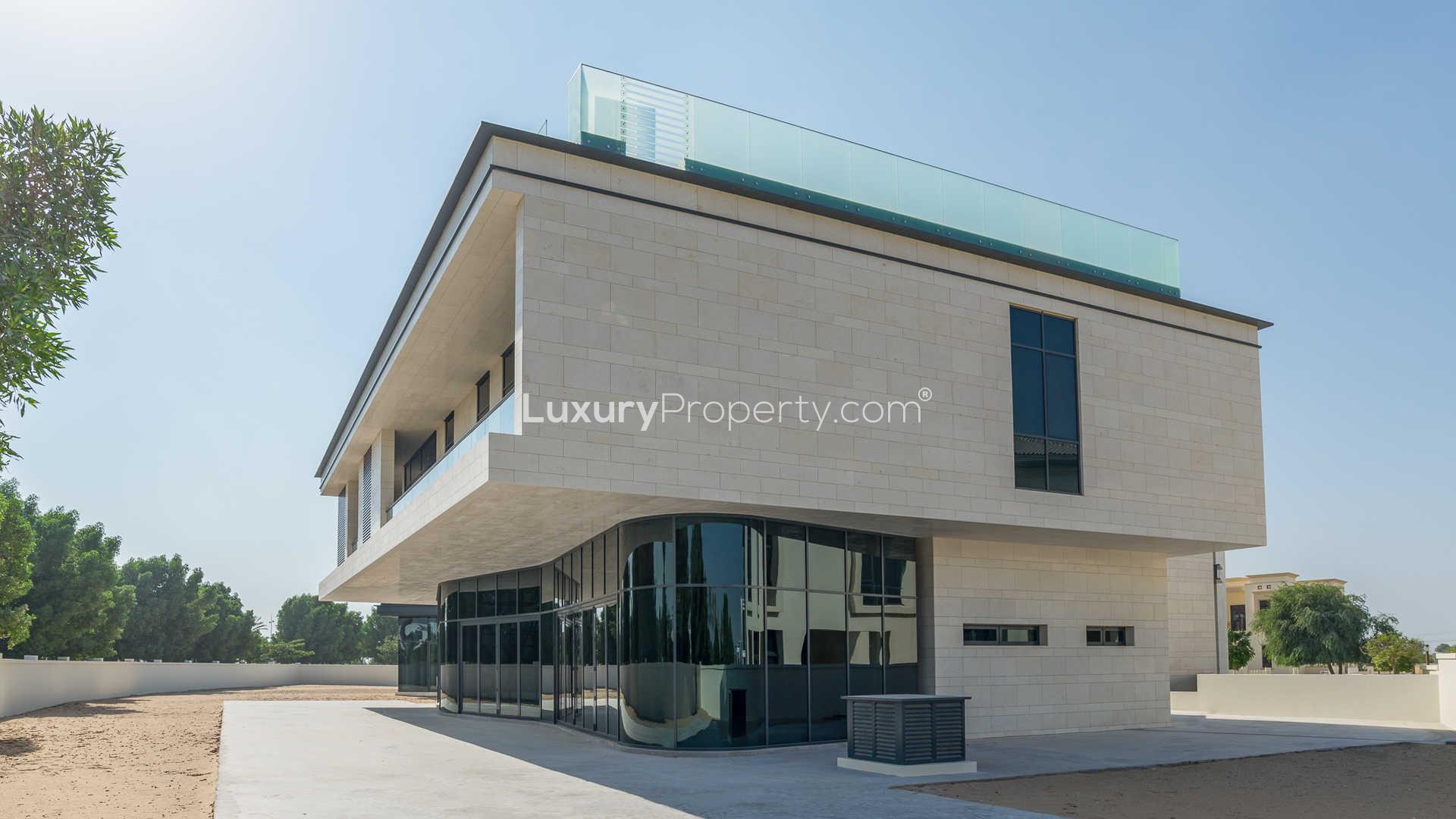Entrance to Dubai Hills Estate with lush greenery and modern architecture