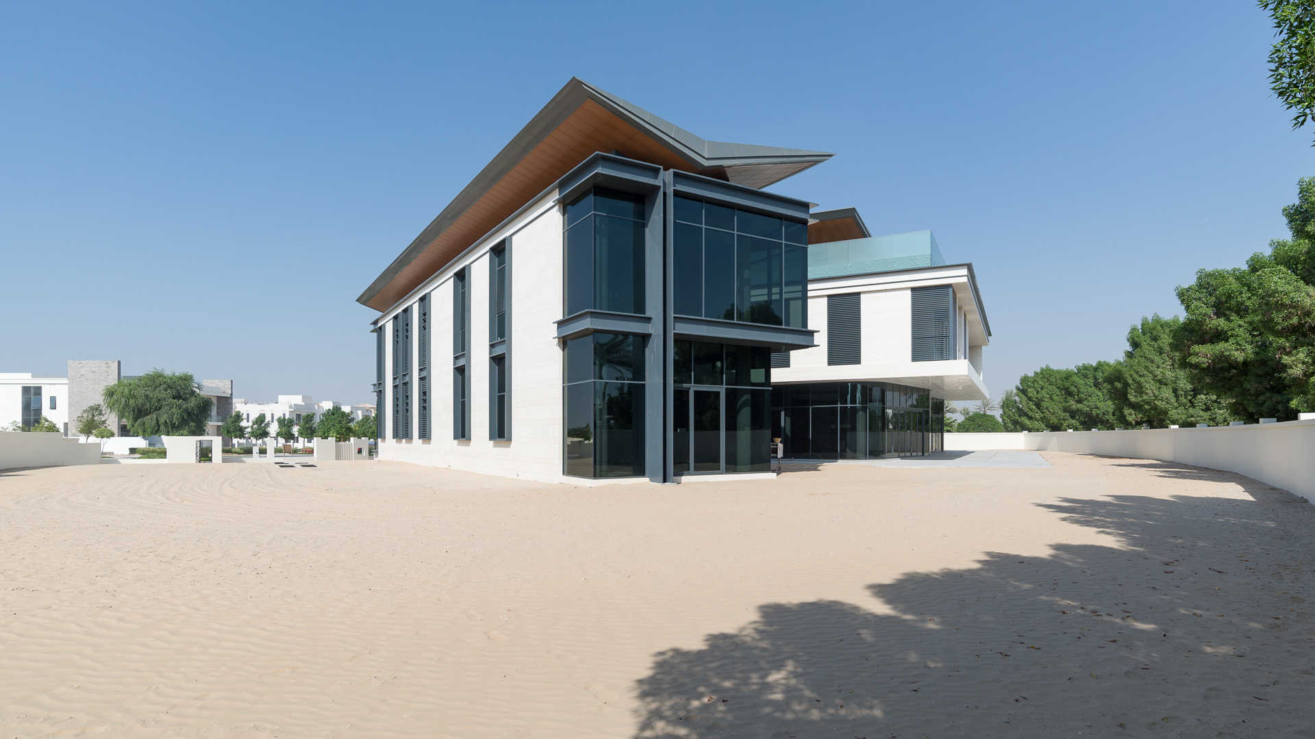 Modern eight-bedroom villa exterior in Dubai Hills Grove, featuring sleek architecture and large windows