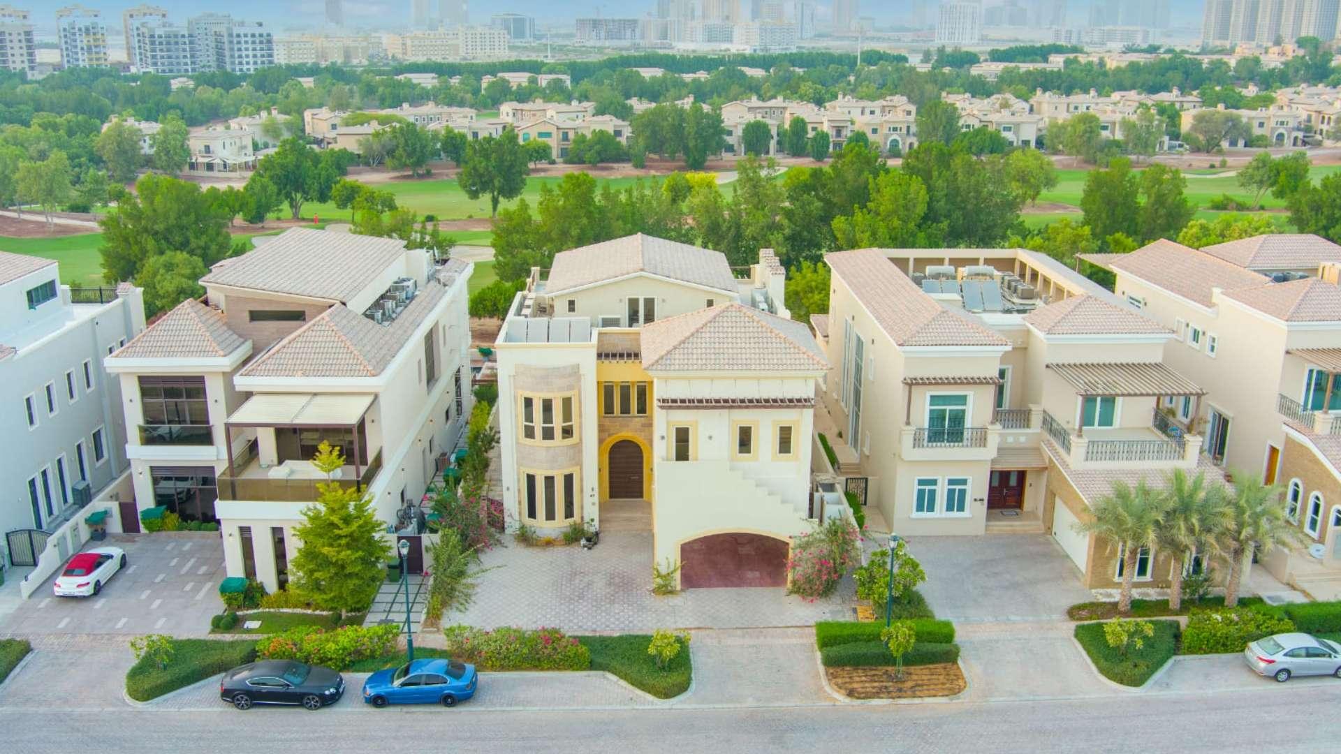 Aerial view of luxury villa with pool in Jumeirah Golf Estates, Earth community