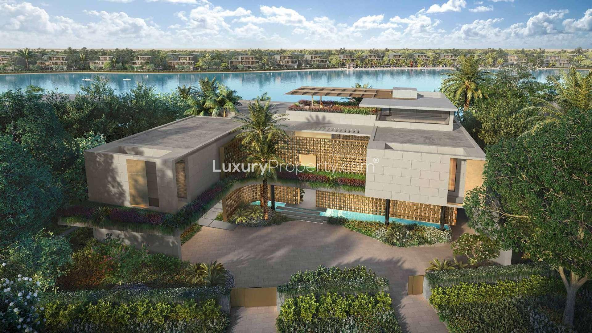 Modern Tilal Al Ghaf villa exterior with lush landscaping, available for sale