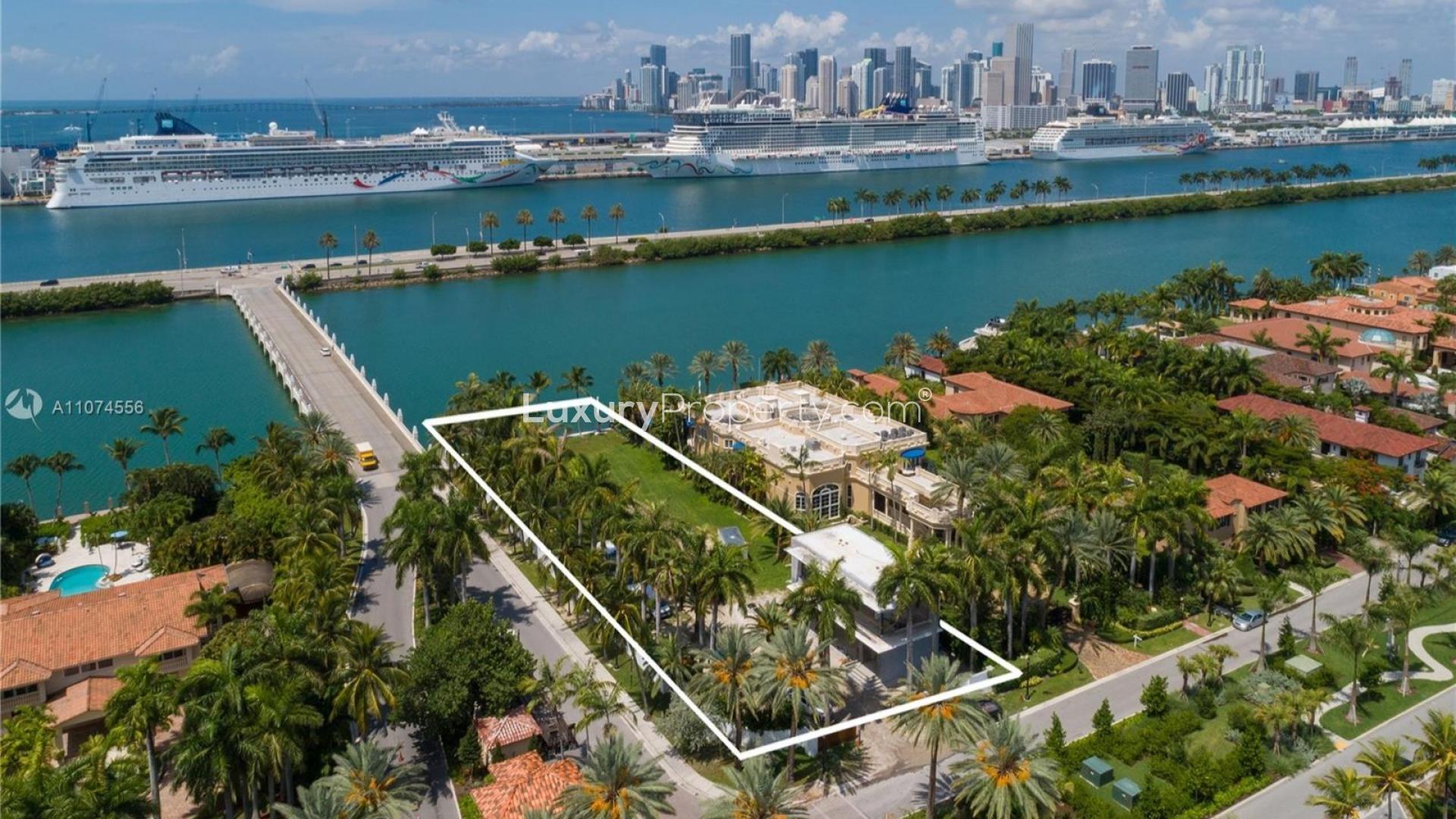 Luxurious Miami Beach waterfront villa with pool, modern design, and lush landscaping