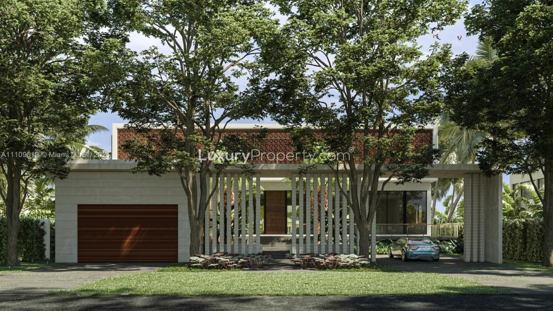 Luxury Miami villa entrance with palm trees and modern architecture at 11420 N Bayshore Dr