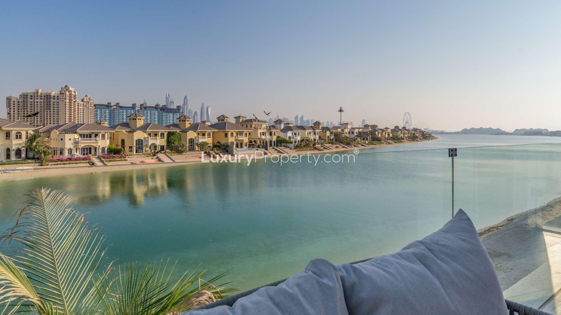 Luxurious beachfront villa on Palm Jumeirah's Billionaire's Row, showcasing modern architecture and palm trees