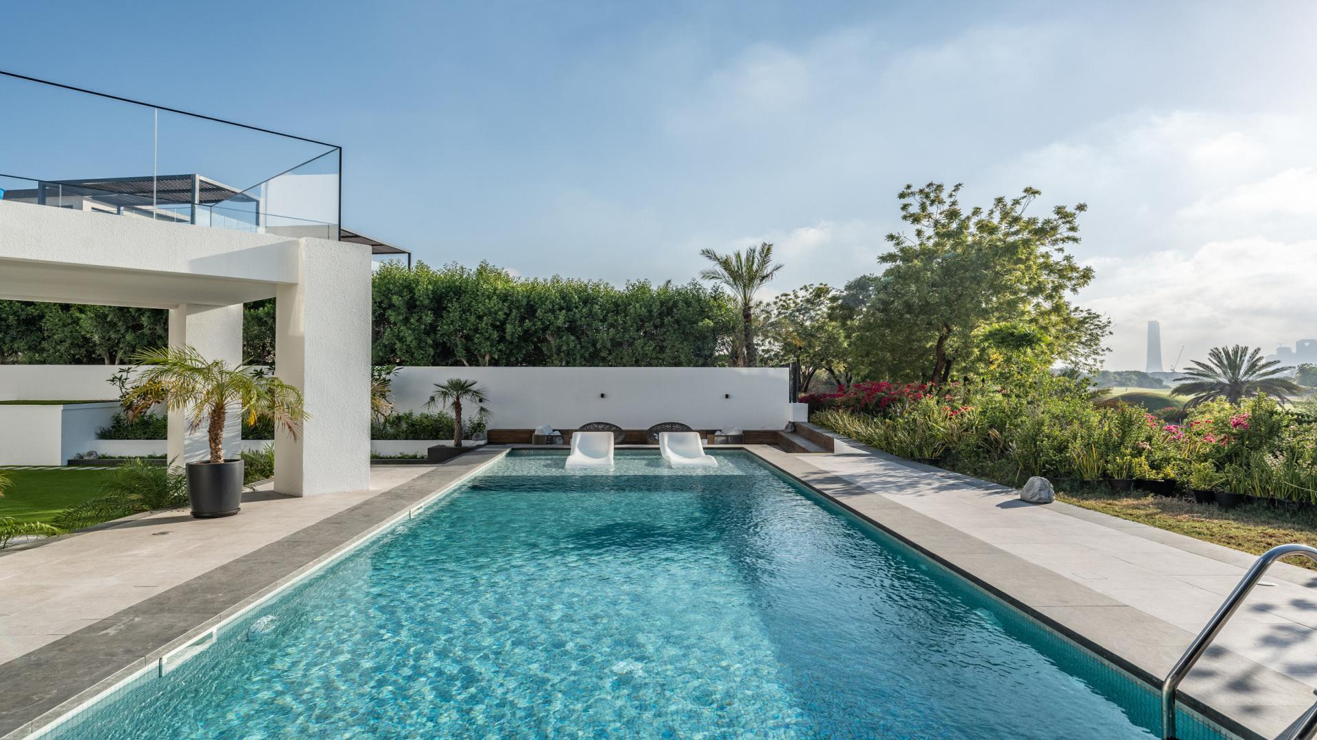 Aerial view of luxury villa garden and pool in Emirates Hills, Dubai