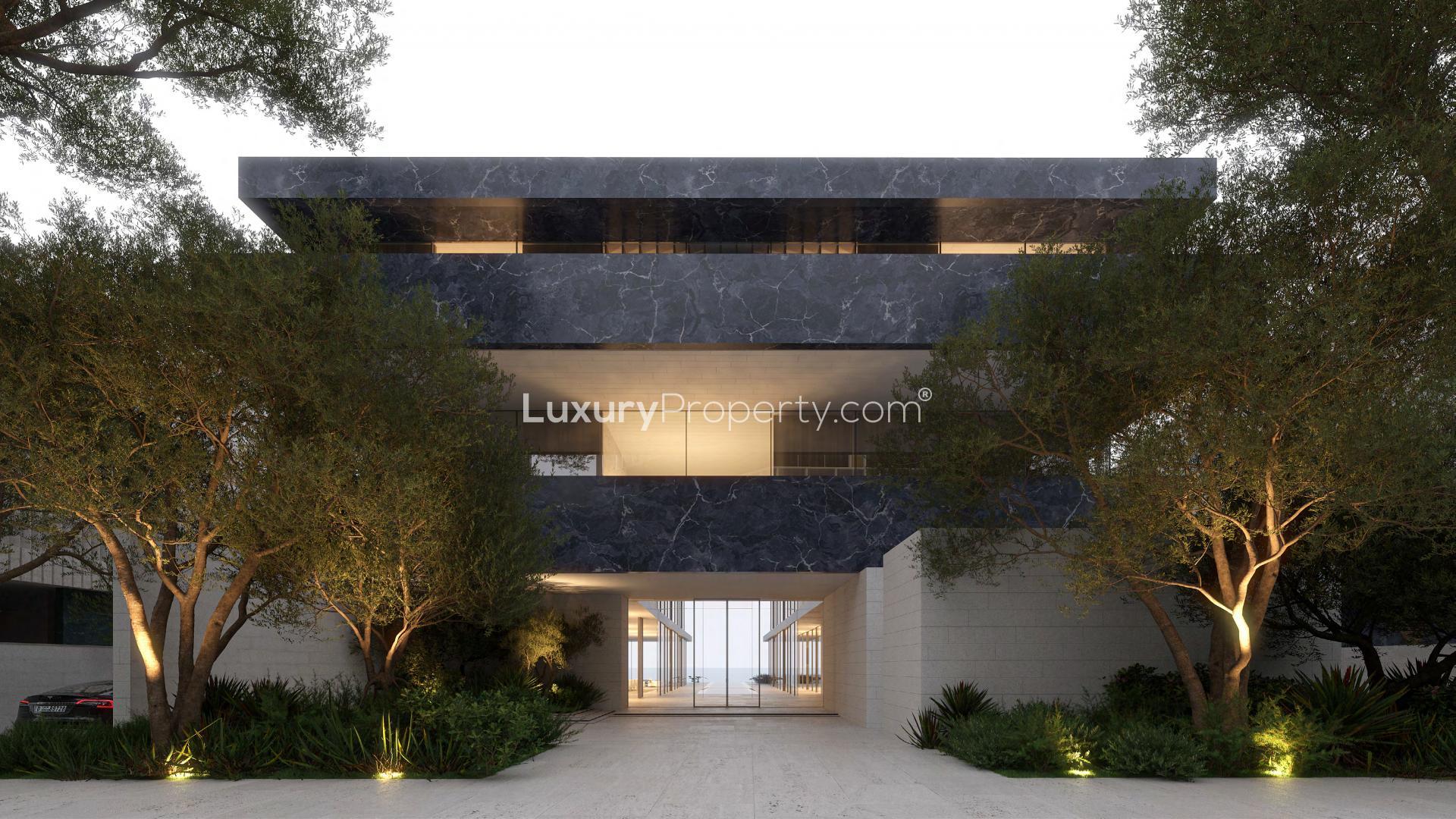 Luxury villa exterior at Ritz-Carlton Creekside with poolside view and modern design