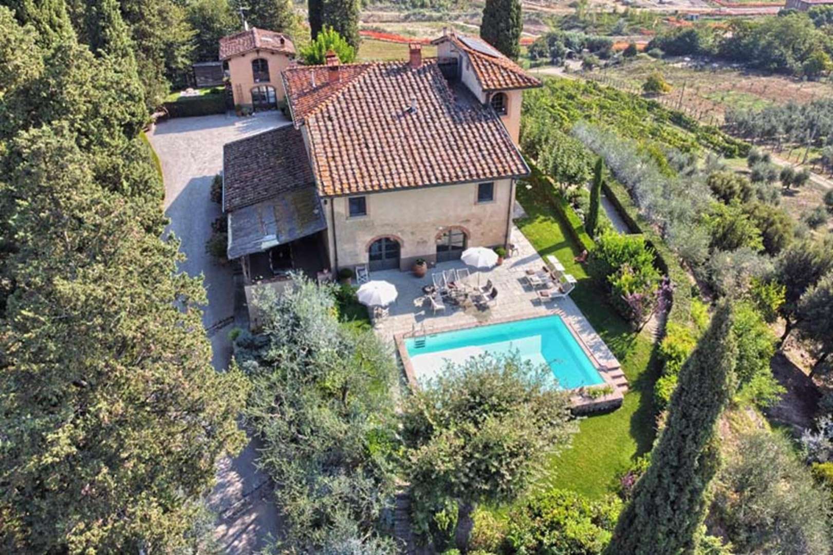 Aerial view of charming Tuscan villa with lush gardens in Arezzo, Villa Donna Elena