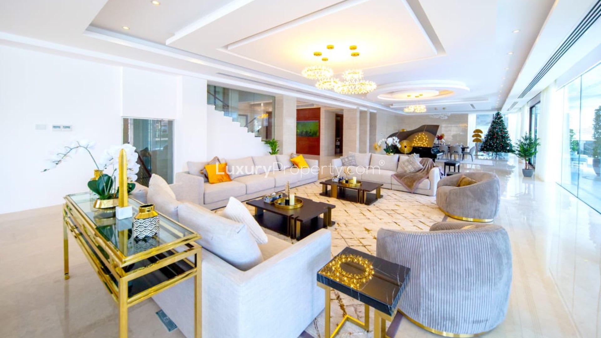 Luxurious bedroom in 8-bedroom villa, Palm Jumeirah, with modern decor and large windows