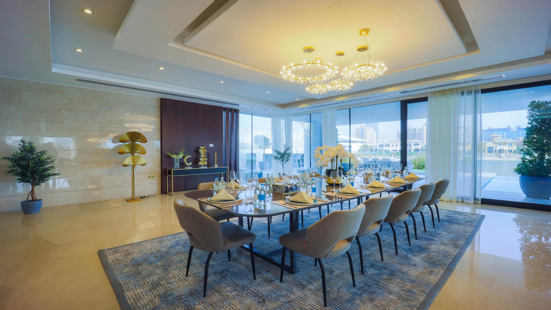 Luxurious dining and living area in Villa Neeto, Palm Jumeirah, featuring elegant decor