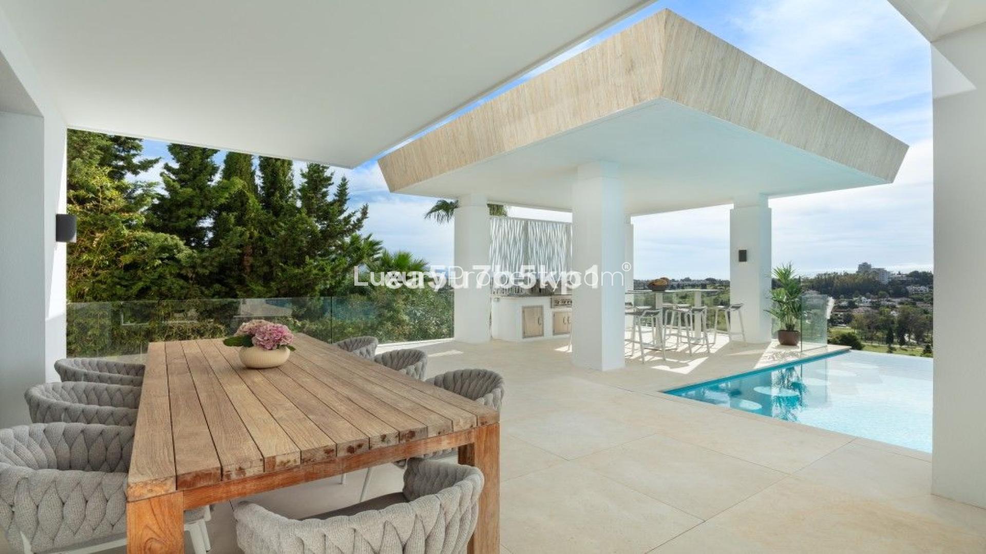 Luxurious villa terrace with pool and panoramic views in El Paraiso, Estepona