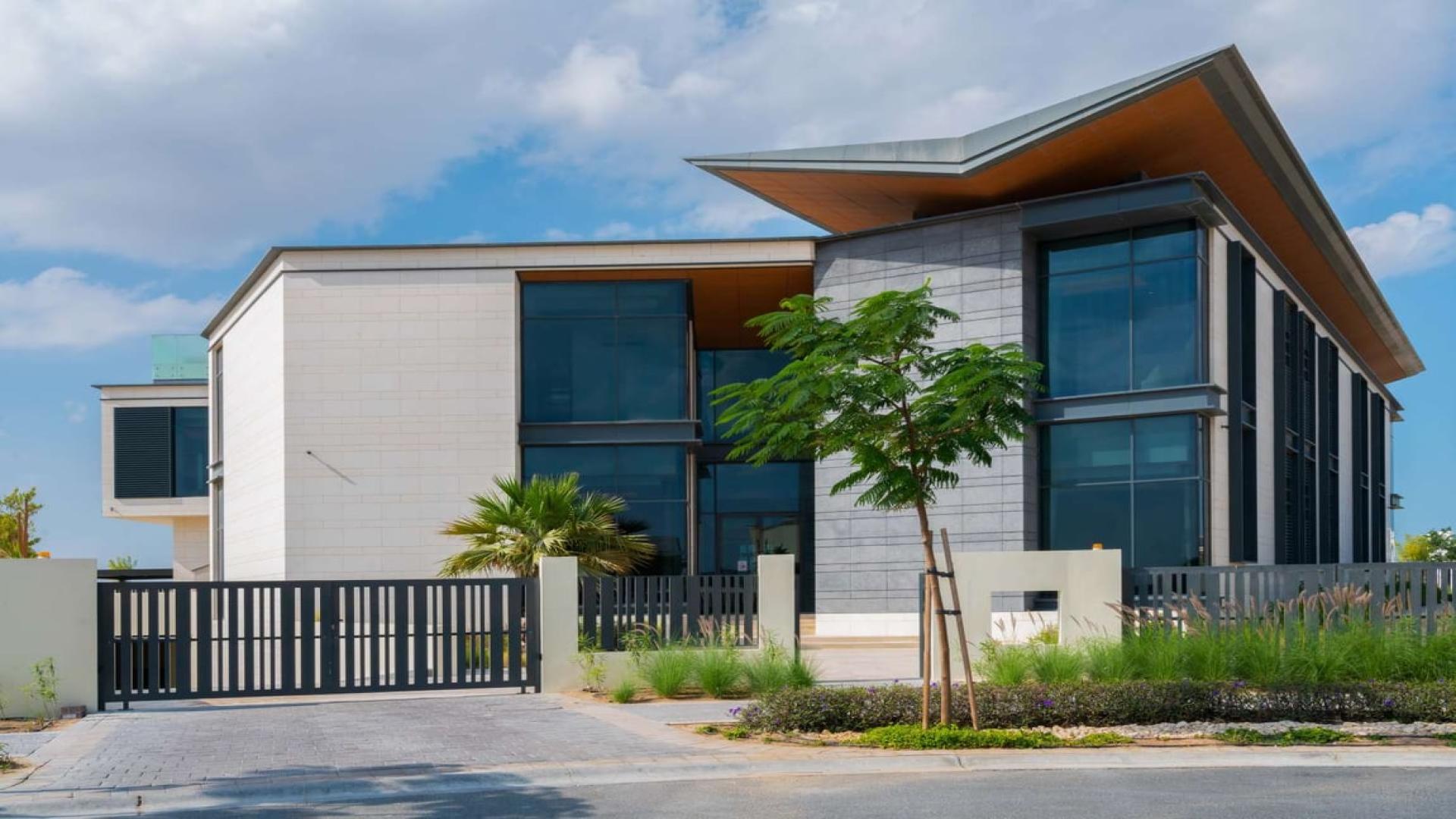 Spacious dining area in luxury 9-bedroom villa, Dubai Hills View, with modern design elements