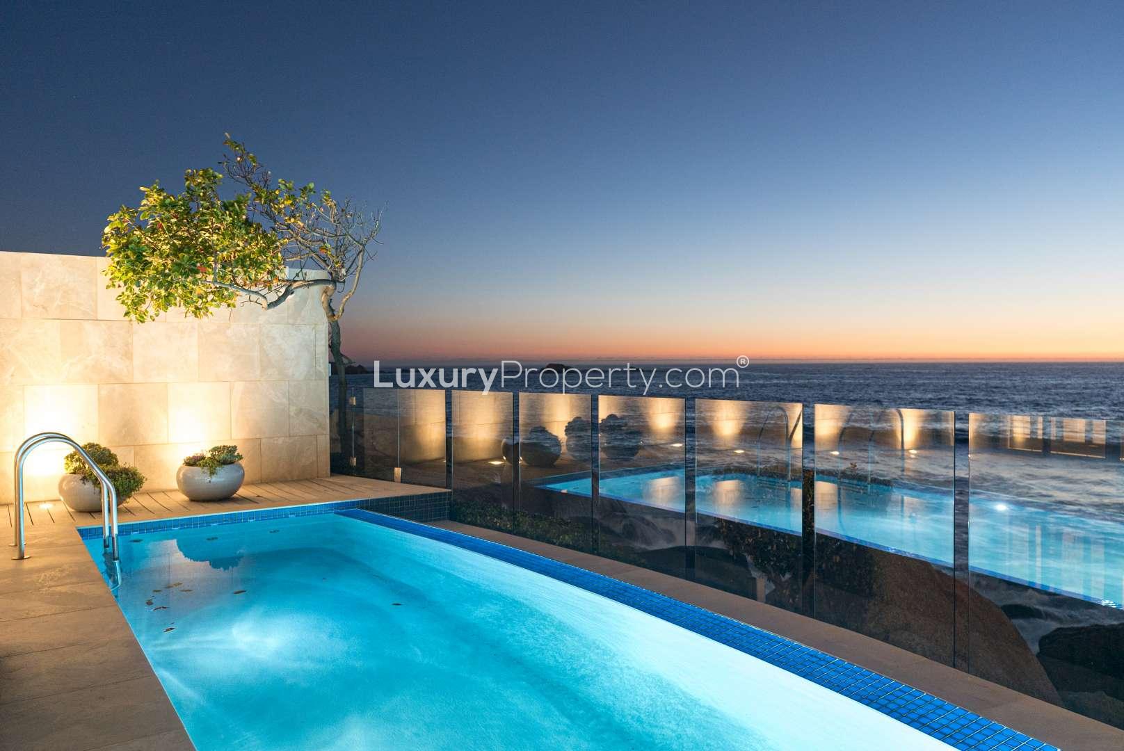 Sunset view from luxury apartment pool in Clifton, Cape Town, beachfront property for sale