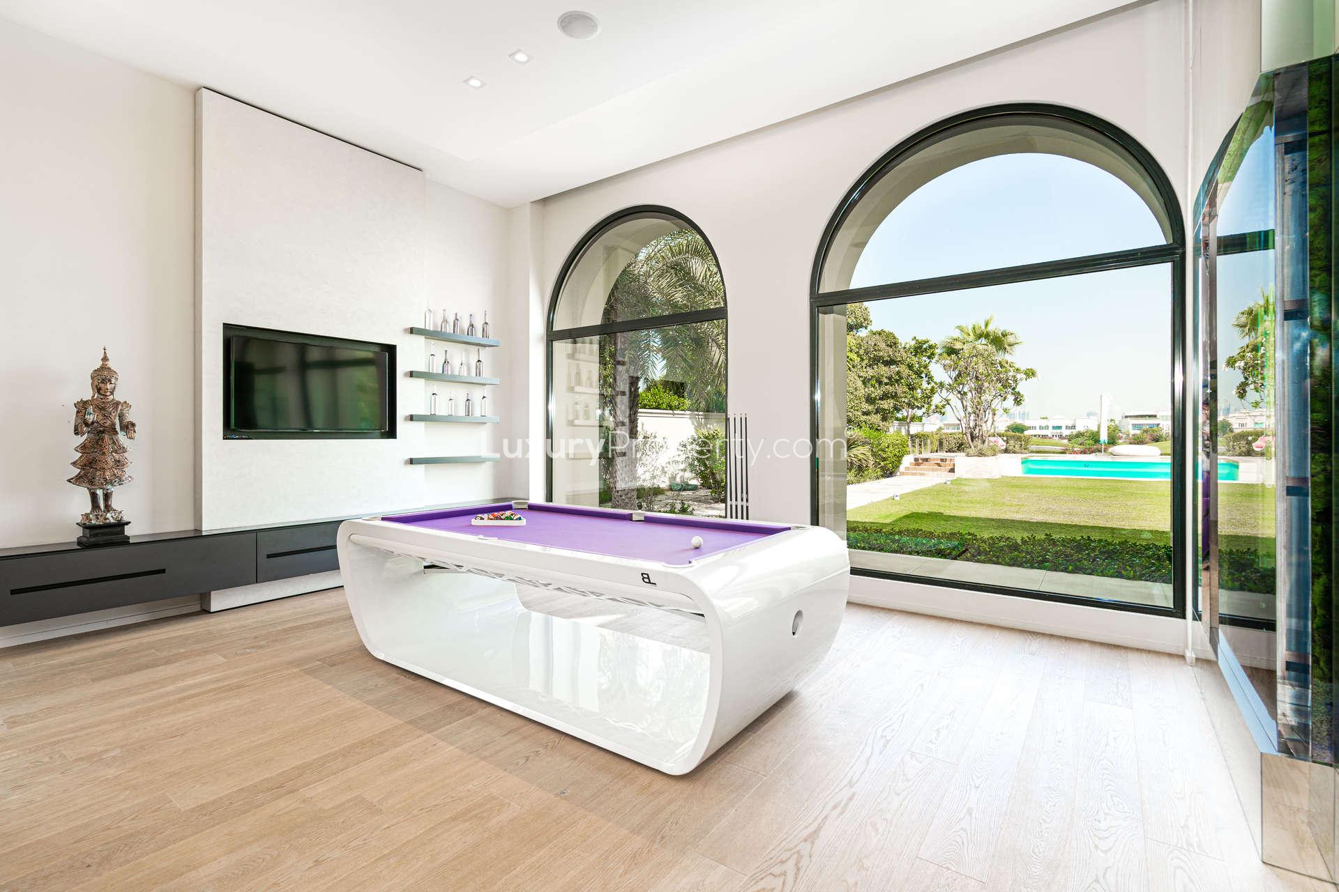 Modern kitchen in luxurious Emirates Hills villa, featuring sleek design and vibrant accents