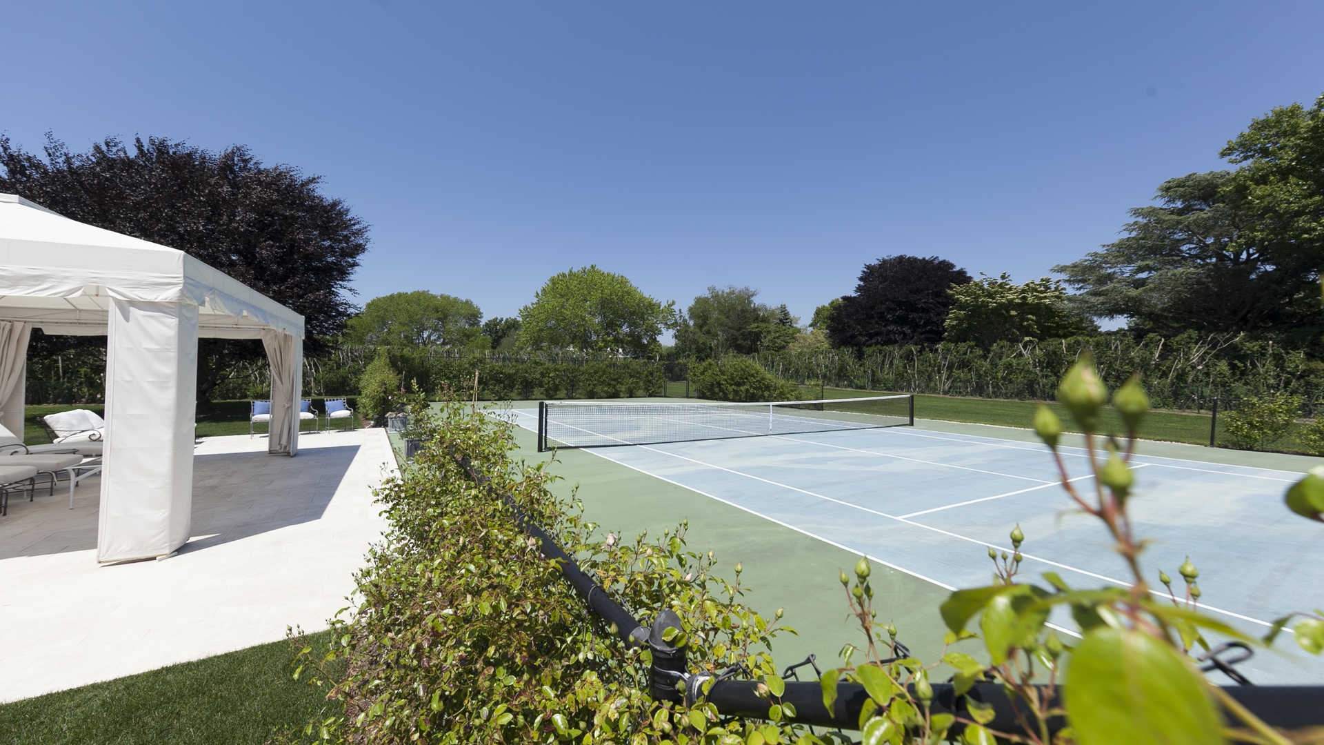 Aerial view of luxurious 9-bedroom villa with pool on Gin Lane, Southampton, Hamptons