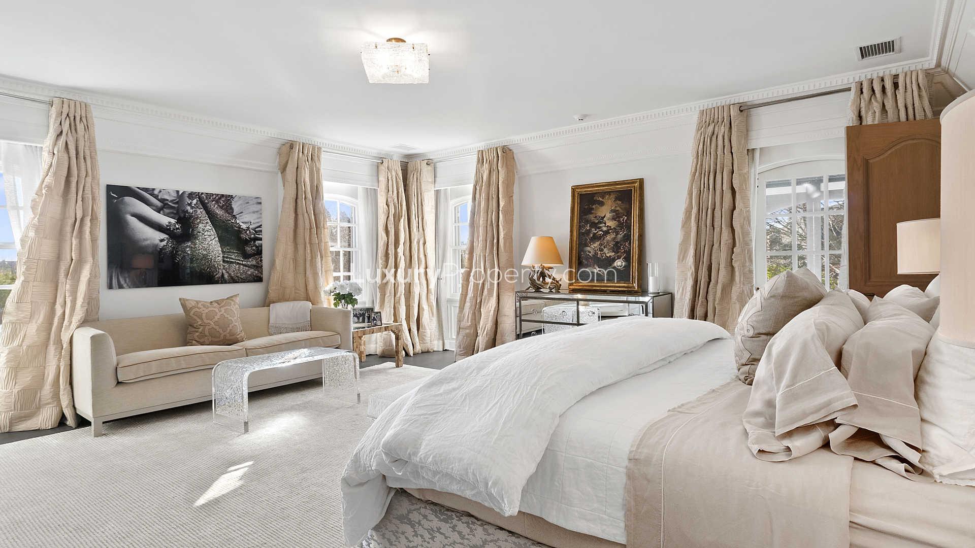 Elegant living room in Normandy Estate villa, Hamptons, featuring fireplace and grand piano