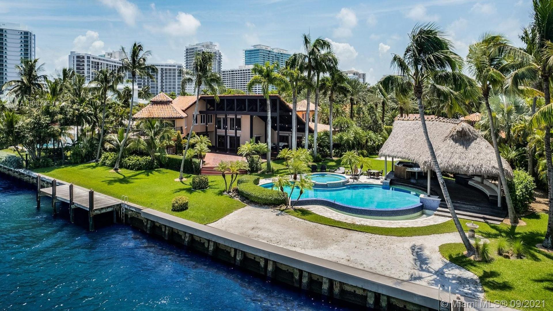 Bayfront villa with private dock, lush greenery, and scenic water views in Miami, Florida