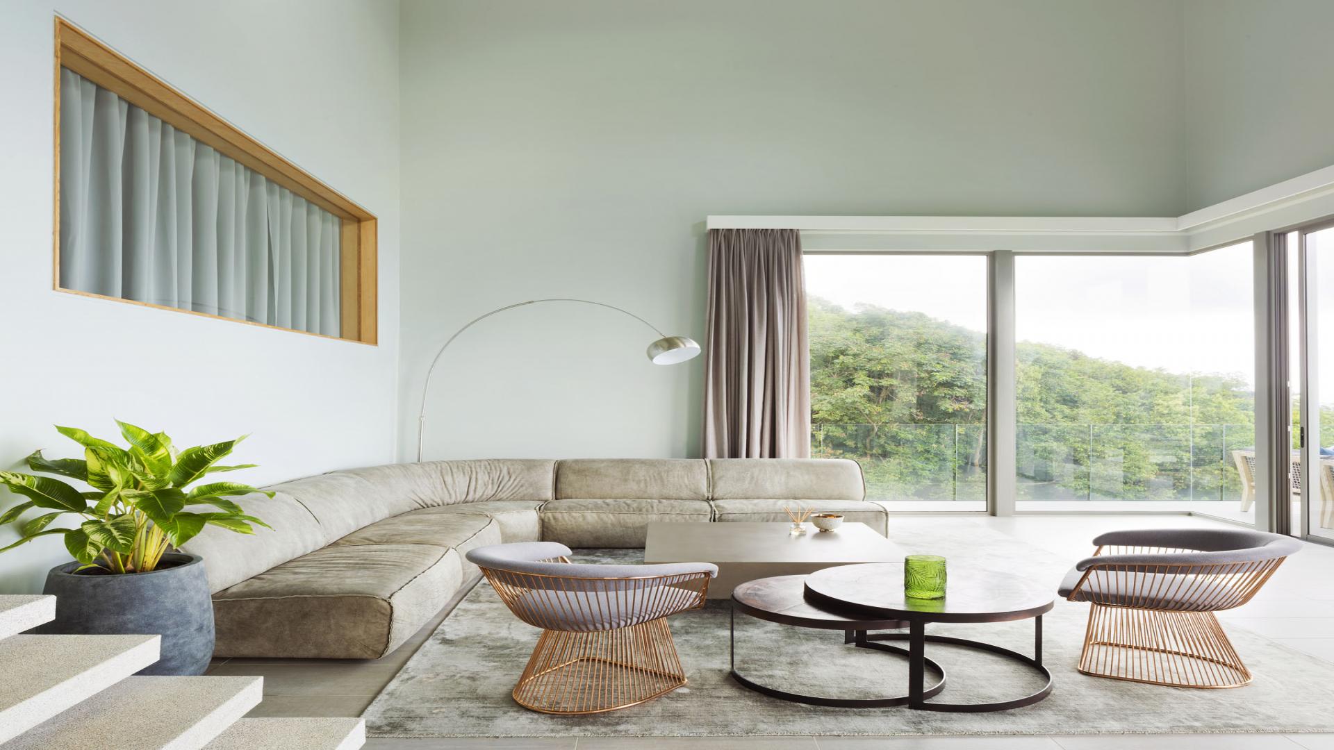 Aerial view of modern villa in lush Royal Palm Estate, Mahe, for sale