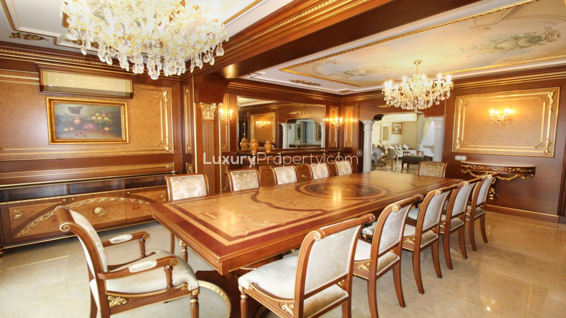 Elegant living room in luxury villa, Guadalmina Baja, featuring plush seating and chandelier