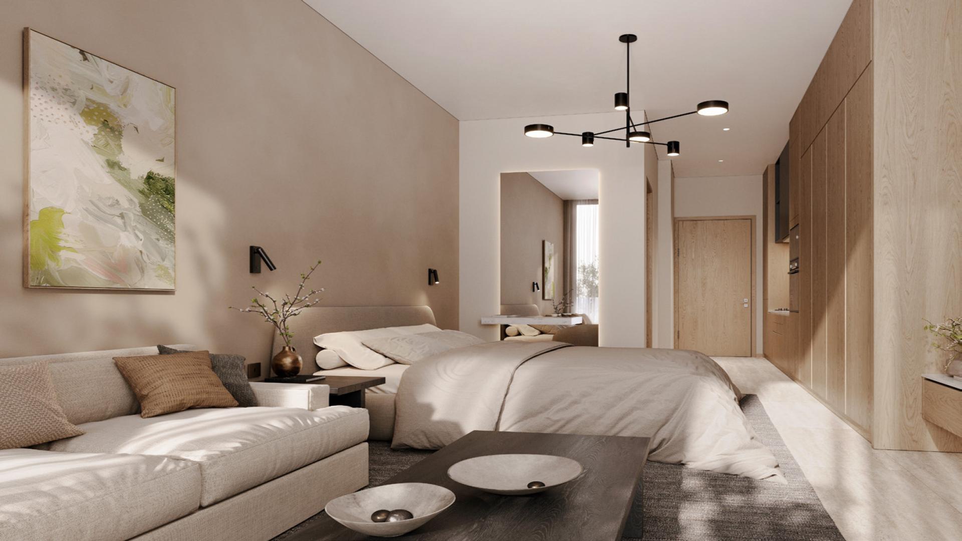 Modern apartment building exterior at The Berkeley, Dubai Hills Estate, surrounded by palm trees