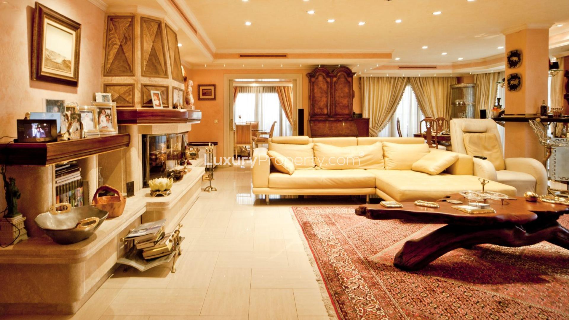 Luxurious villa bedroom with elegant decor, large windows, and wooden ceiling near Puerto Banús