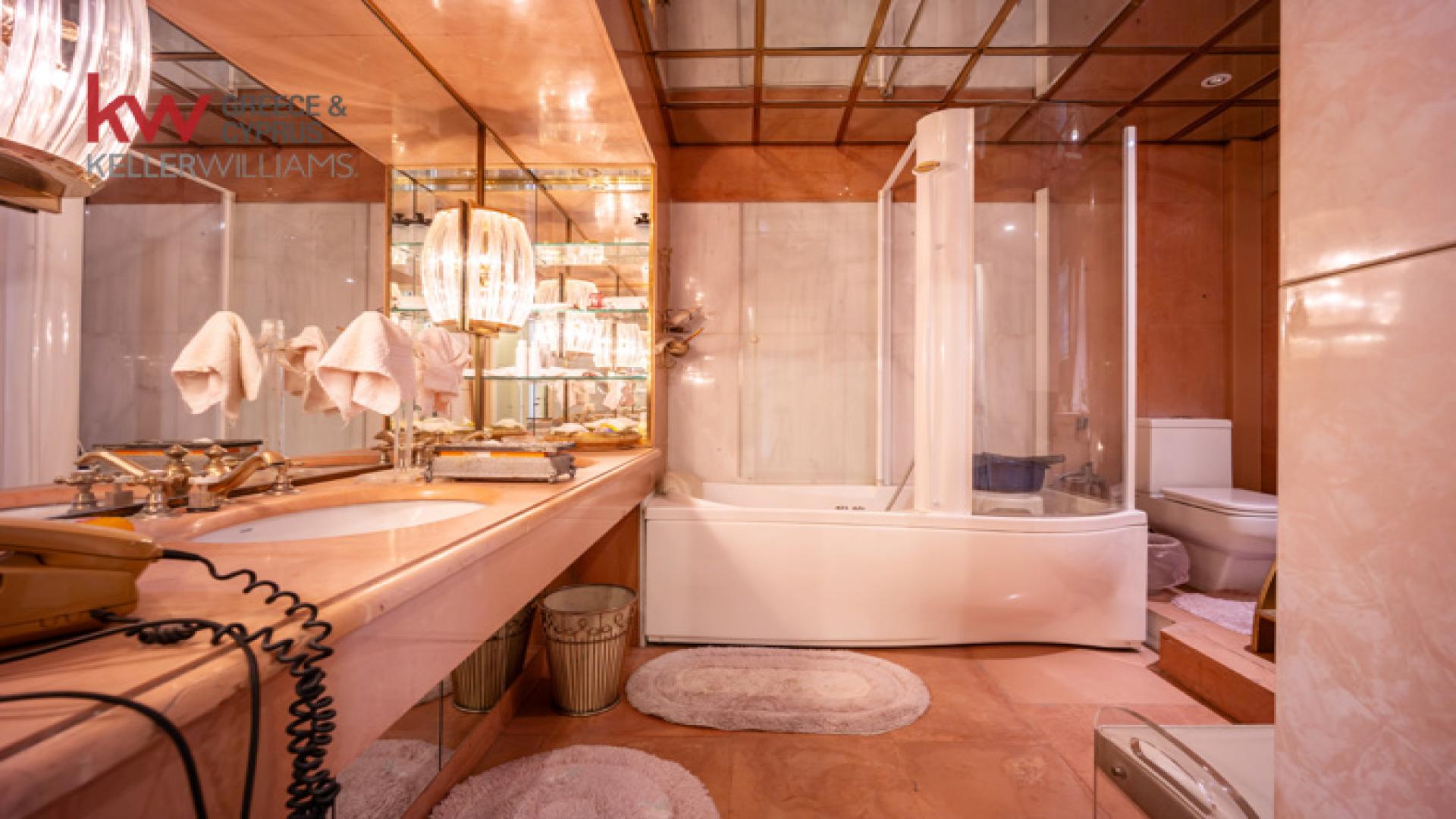 Luxurious bedroom in Kolonaki Anaktora apartment, Athens, with elegant decor and natural light