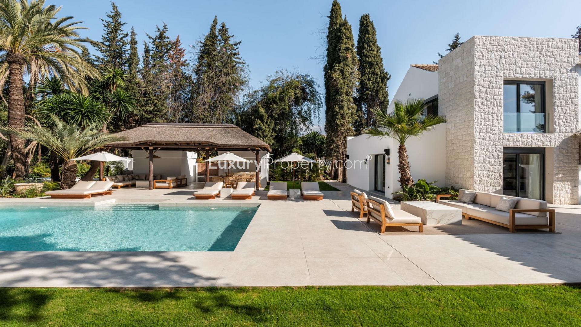 Detached villa exterior in Nueva Andalucía, Marbella, with modern design and lush greenery