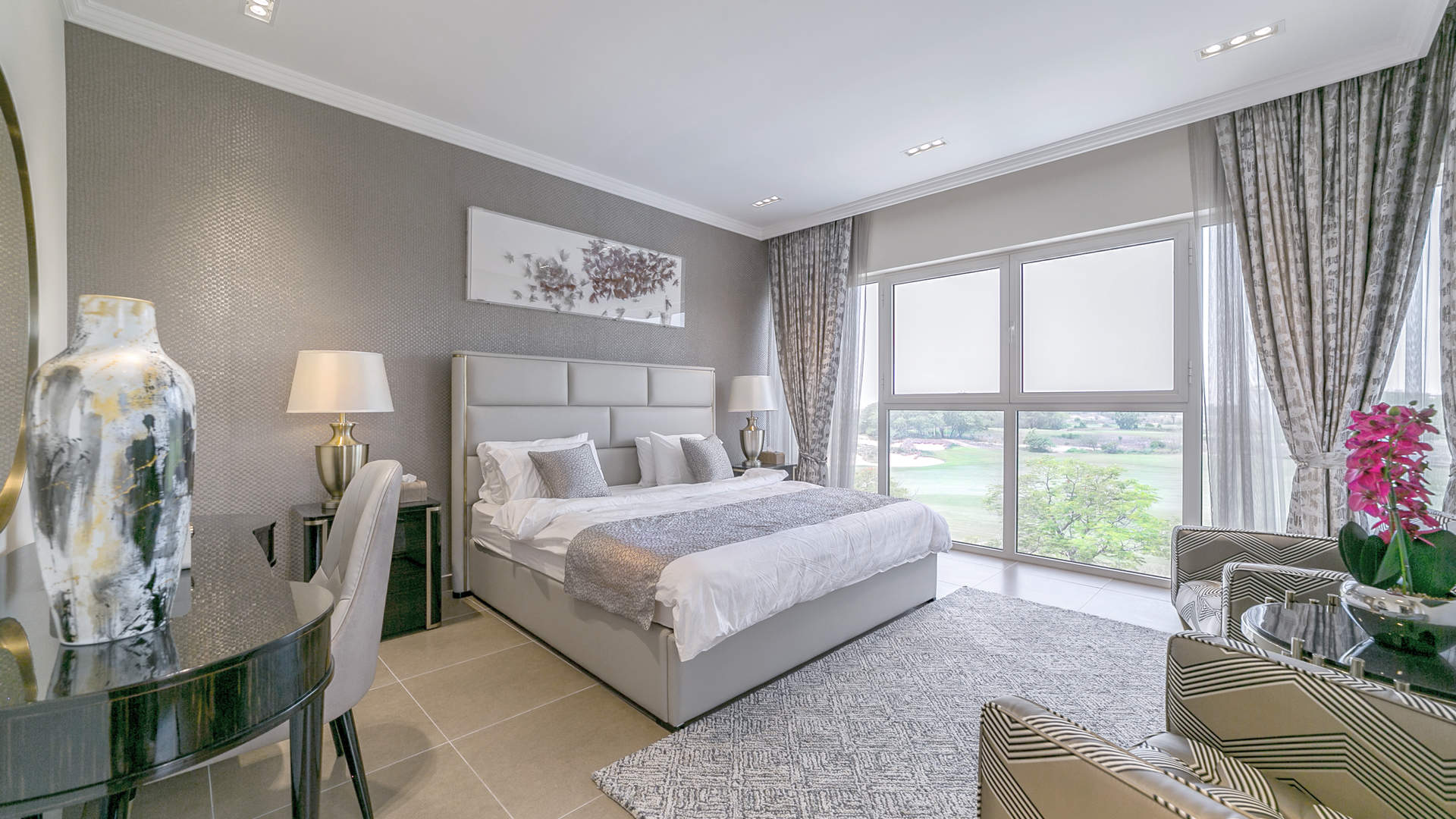 Luxurious villa exterior at Sienna Views, Jumeirah Golf Estates, with garden and driveway