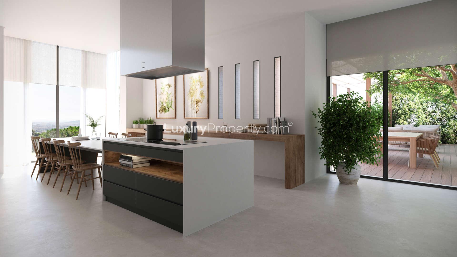 Spacious living room in luxurious Pedralbes villa, Barcelona, with modern decor and artwork