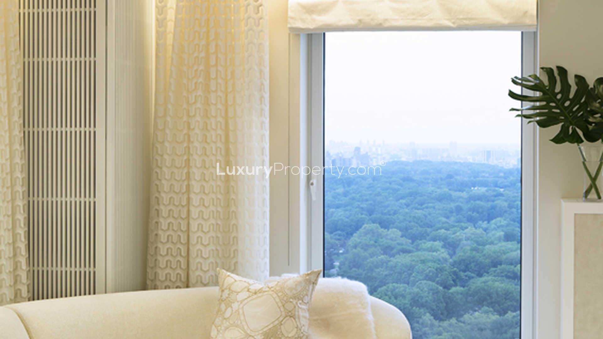 Luxurious Manhattan apartment living room with stunning Central Park view, elegant decor