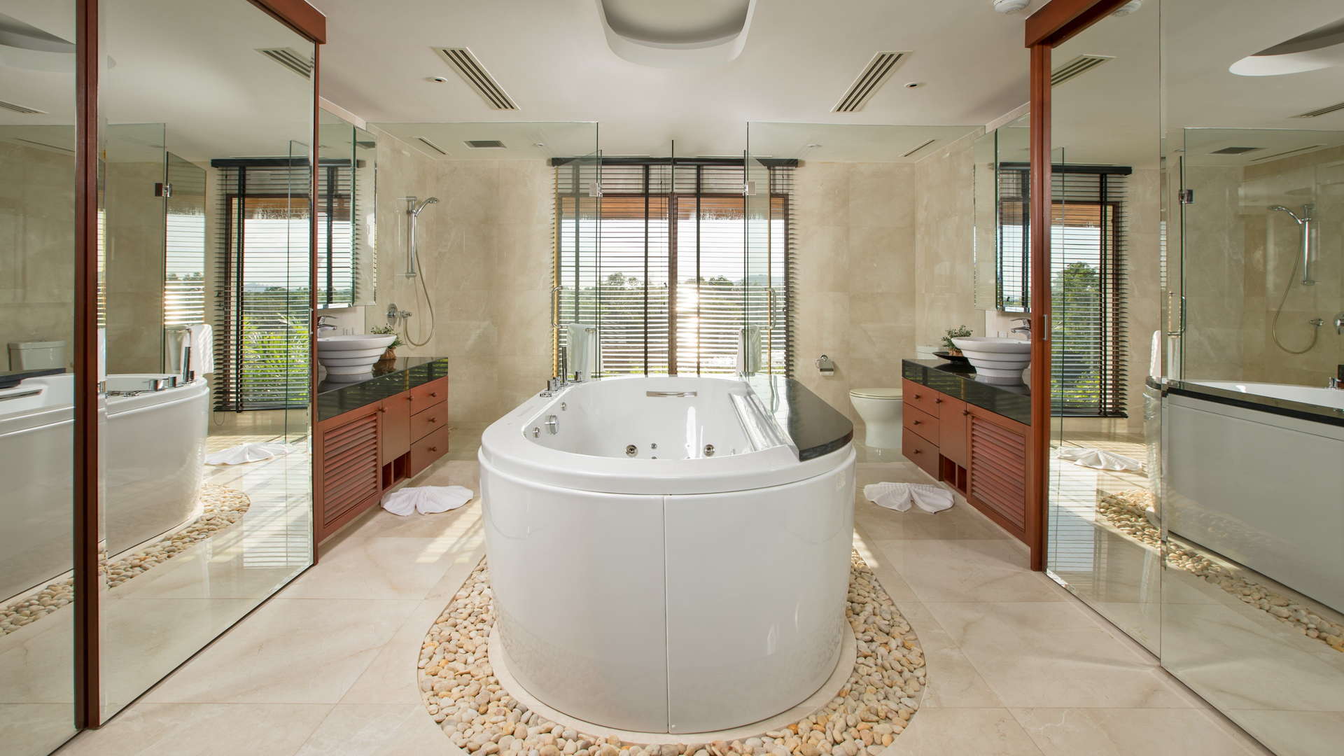 Luxurious living room with garden and pool view in Phuket villa, Royal Phuket Marina