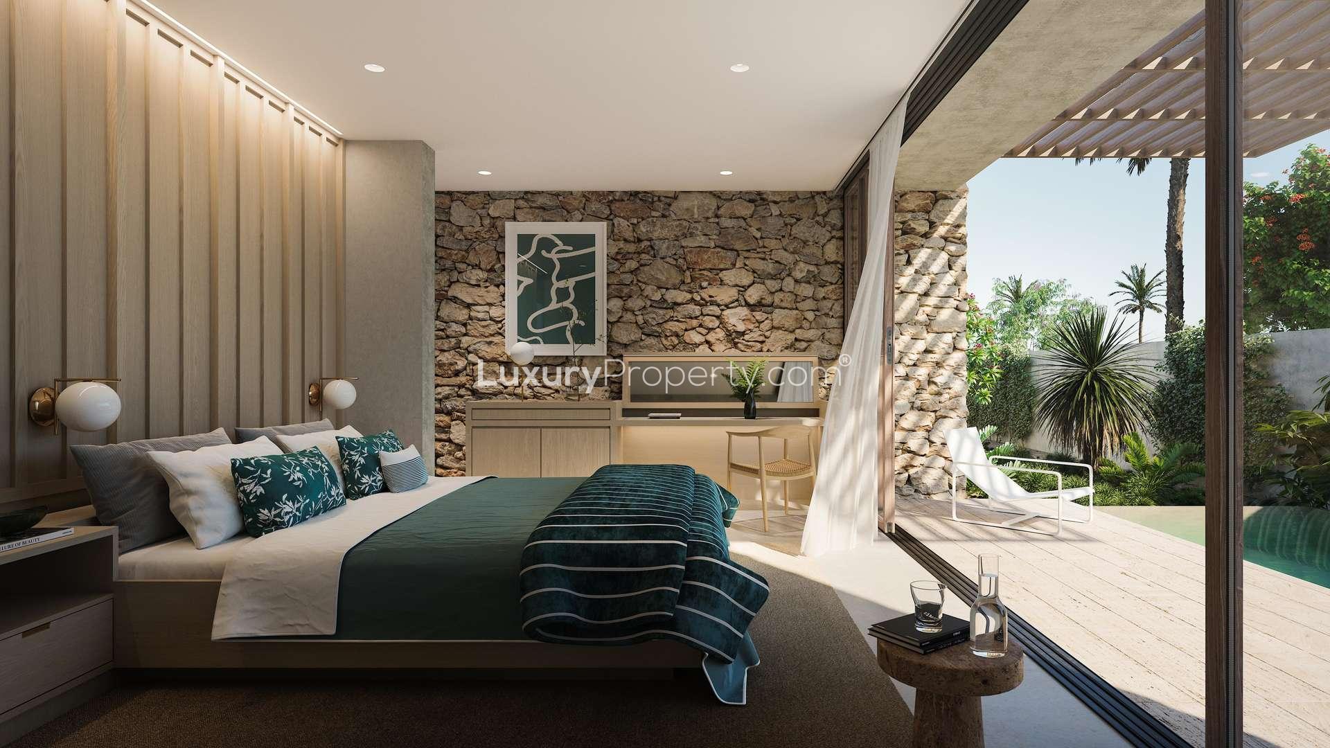 Elegant living and dining area in Ghusoon Villa, Al Jurf Gardens, with natural light