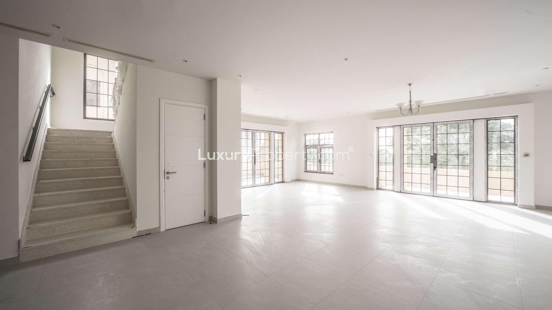 Bright interior of 4-bedroom villa in Whispering Pines, Jumeirah Golf Estates, with large windows