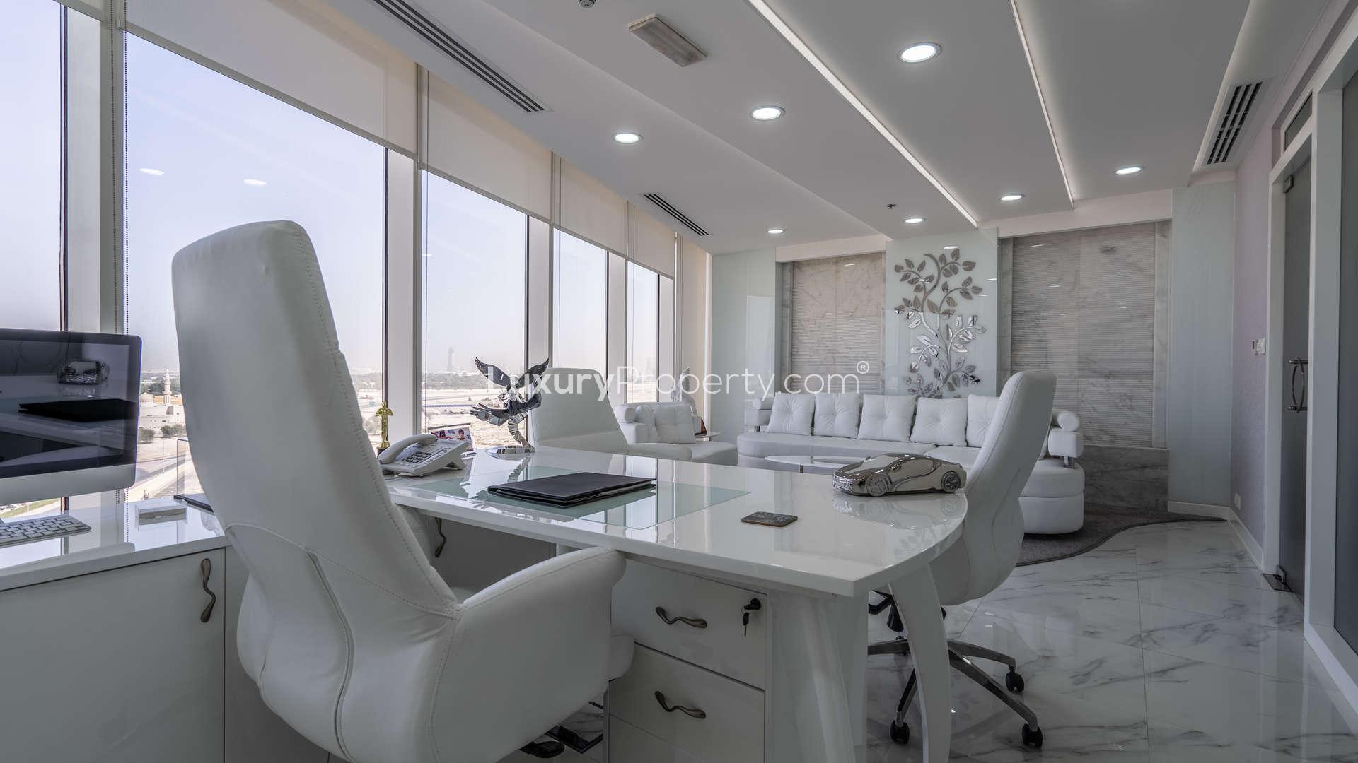 Modern office interior with panoramic city views in Crystal Tower, Business Bay