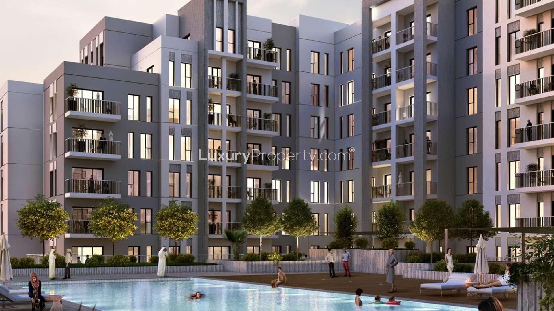 Modern bedroom in 3-bedroom apartment, Hayat Boulevard, Dubai, with balcony and stylish decor