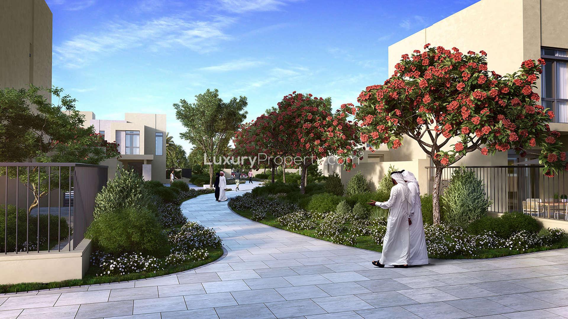 Charming Noor Townhouses community with lush greenery and family-friendly atmosphere in Town Square