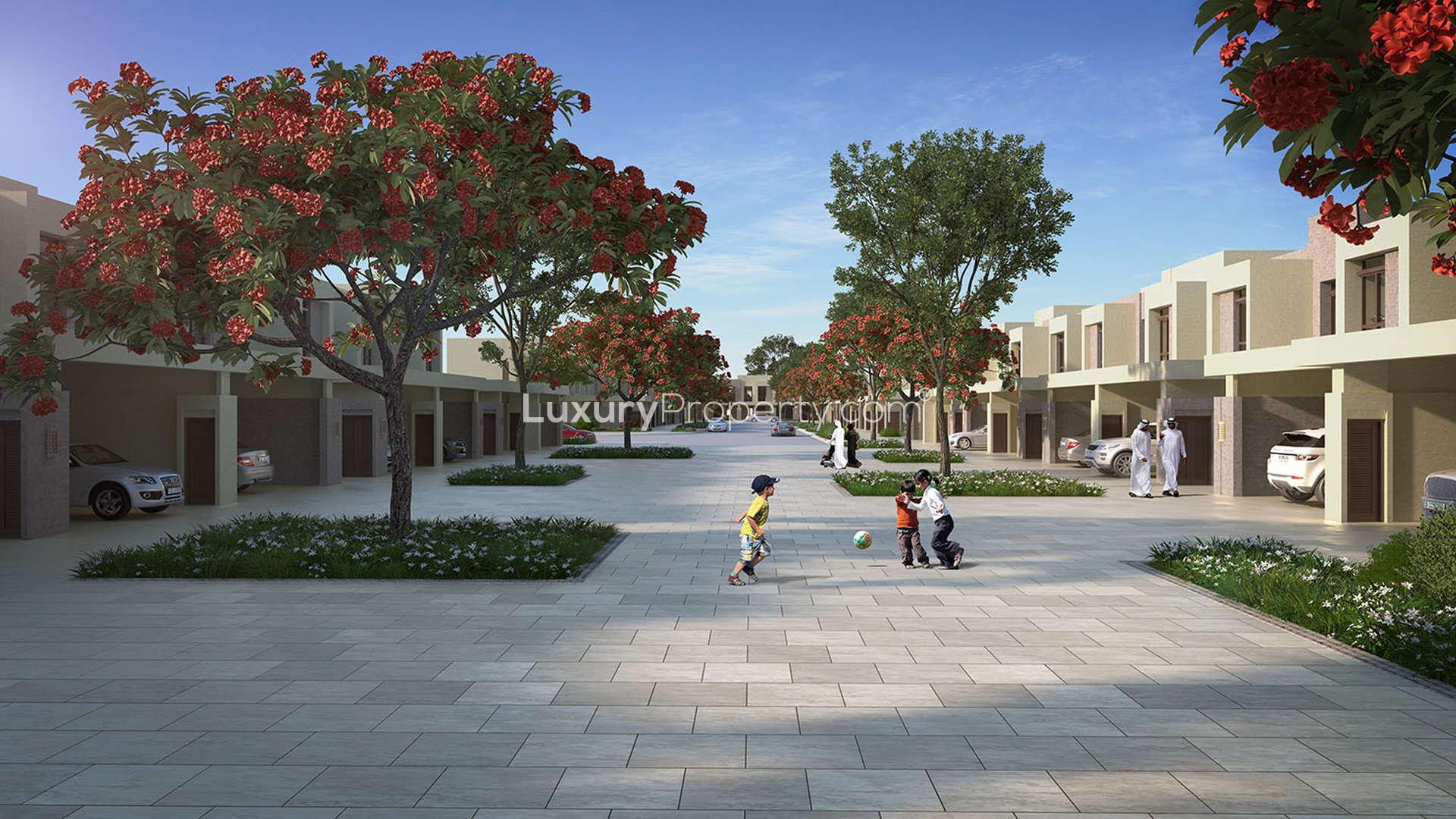 Three-bedroom townhouse exterior with landscaped garden, Noor Townhouses, Town Square community