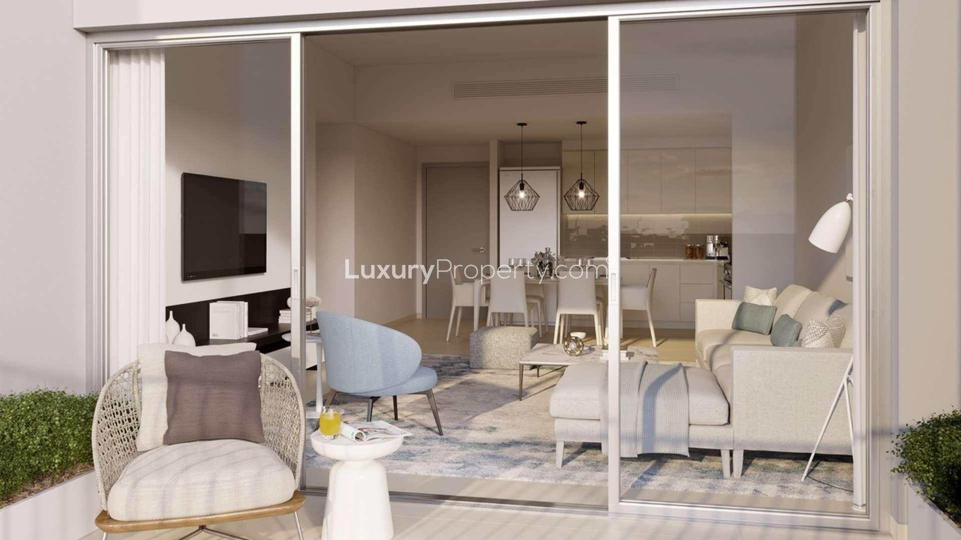 Elegant bedroom with balcony view in Rawda Town Square Dubailand apartment for sale