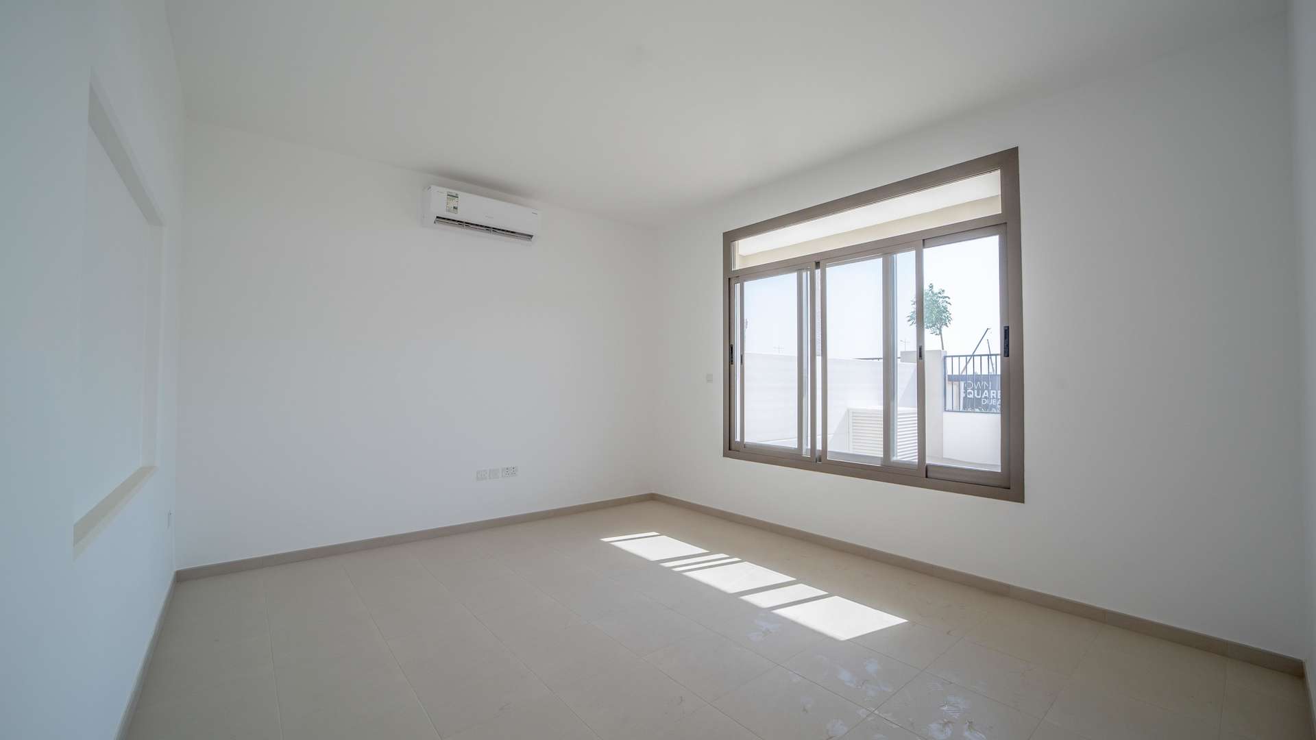 Modern kitchen and living area in 4-bed Hayat Townhouse, Town Square Dubai