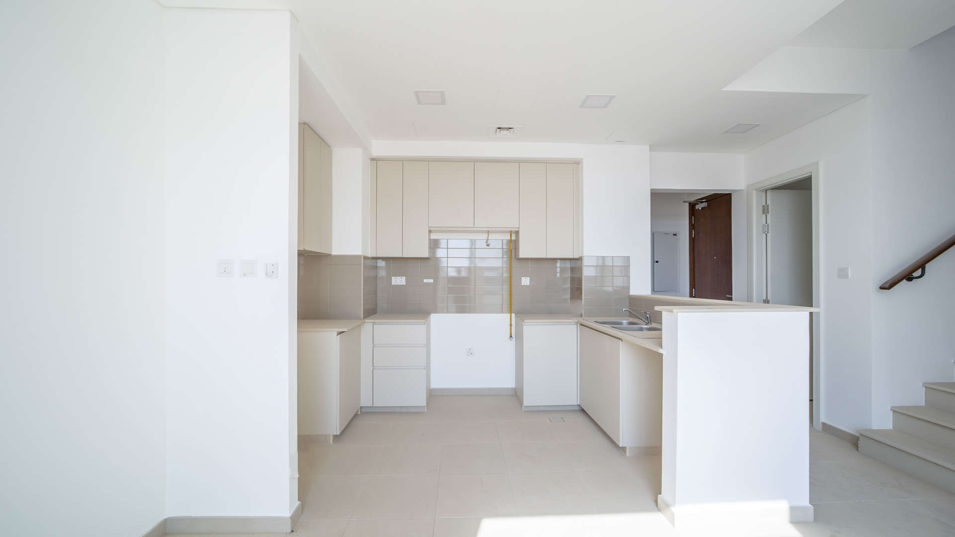 Modern kitchen in 4-bed Hayat Townhouse, Dubai for sale, featuring sleek cabinetry