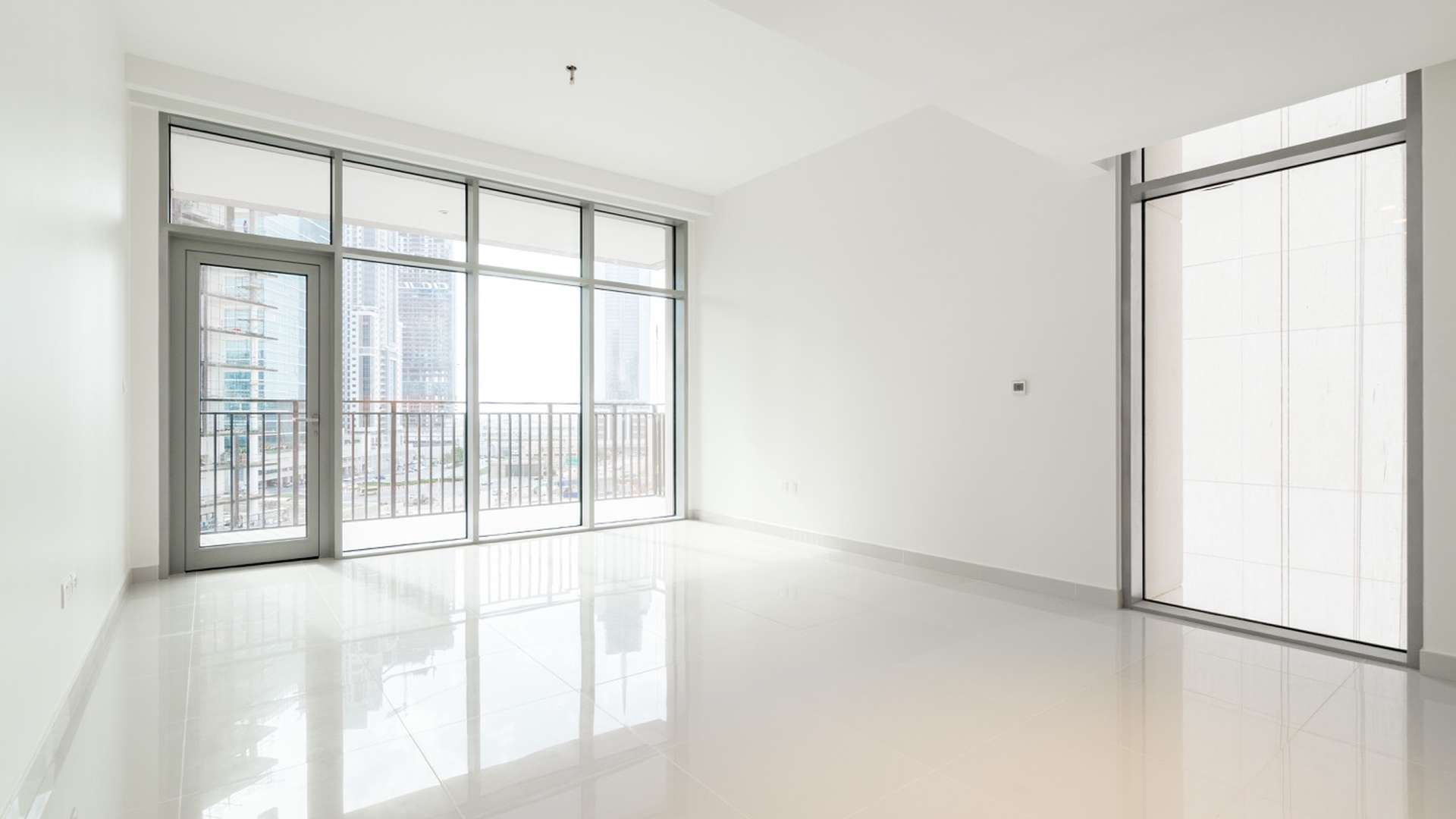 Bright living area with floor-to-ceiling windows in Downtown Dubai apartment for sale